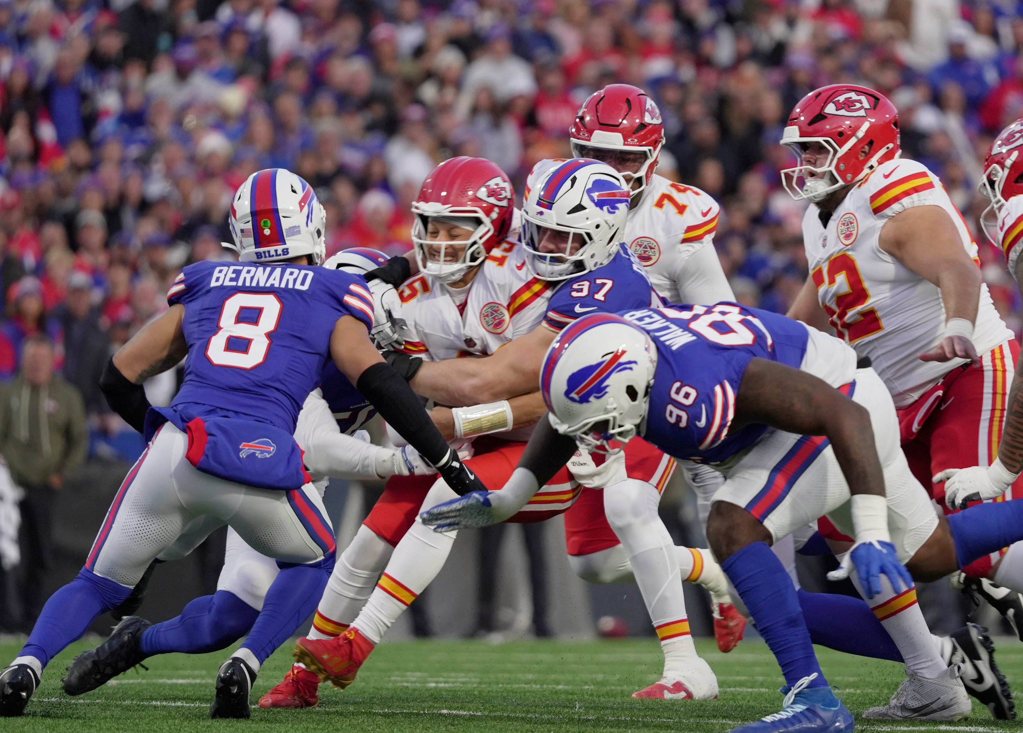 Buffalo Bills defensive end Joey Bosa sacks Kansas City Chiefs quarterback Patrick Mahomes with linebacker Terrel Bernard