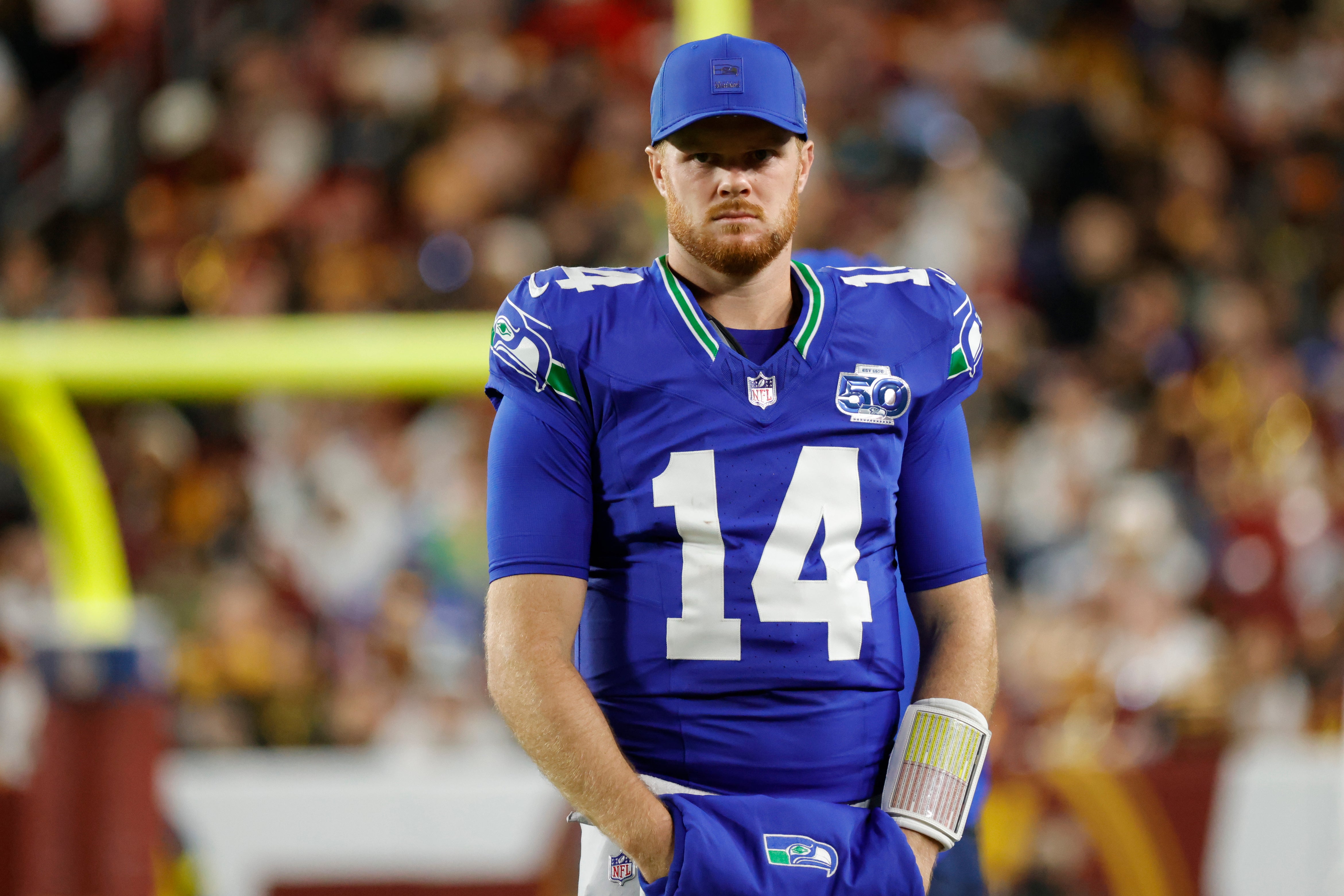Nov 2, 2025; Landover, Maryland, USA; Seattle Seahawks quarterback Sam Darnold (14) looks on during the first half against the Washington Commanders at Northwest Stadium.