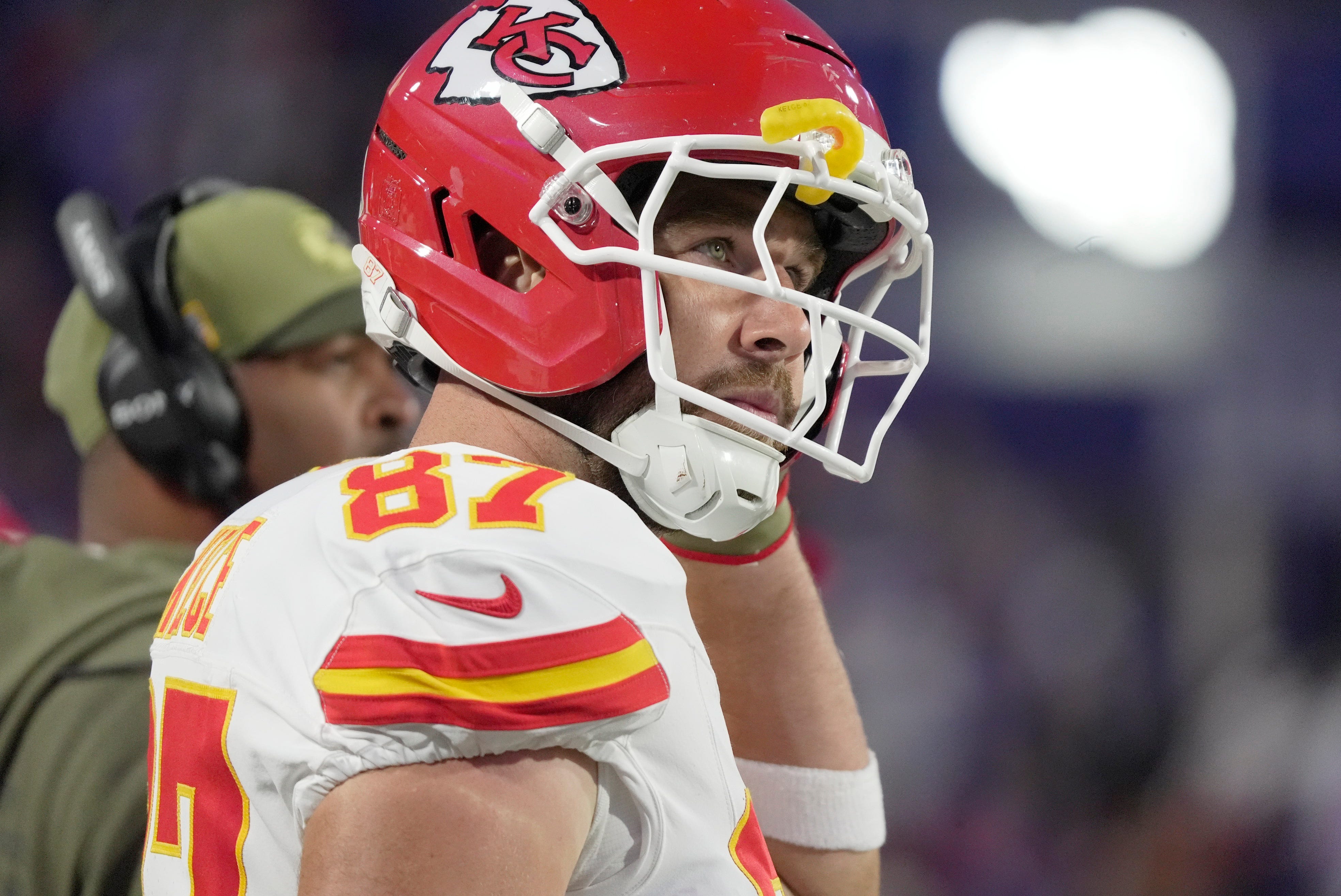 Kansas City Chiefs tight end Travis Kelce puts on his helmet getting ready to take the field