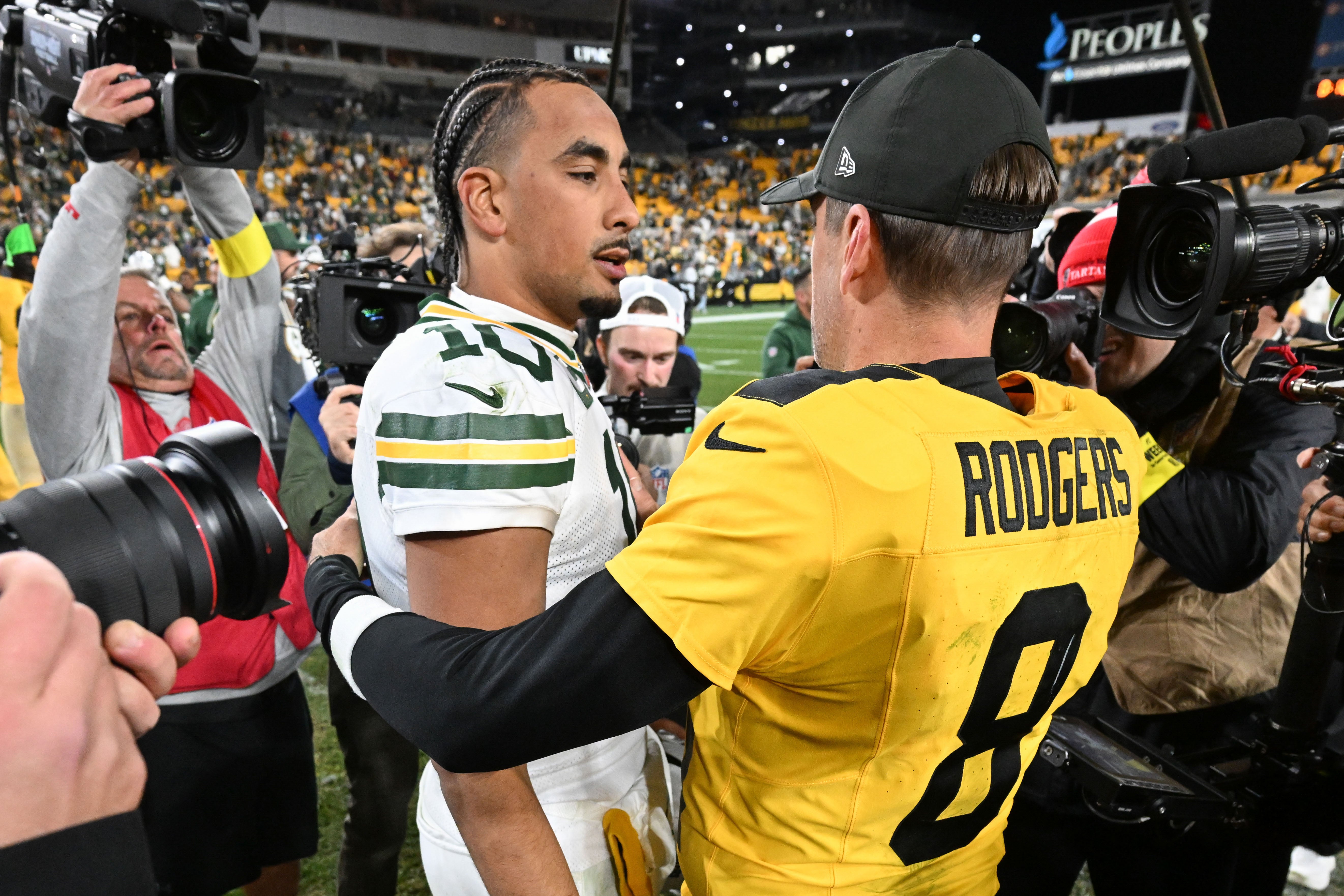 Oct 26, 2025; Pittsburgh, Pennsylvania, USA; Pittsburgh Steelers quarterback Aaron Rodgers (8) greets Green Bay Packers quarterback Jordan Love (10) following their game at Acrisure Stadium.