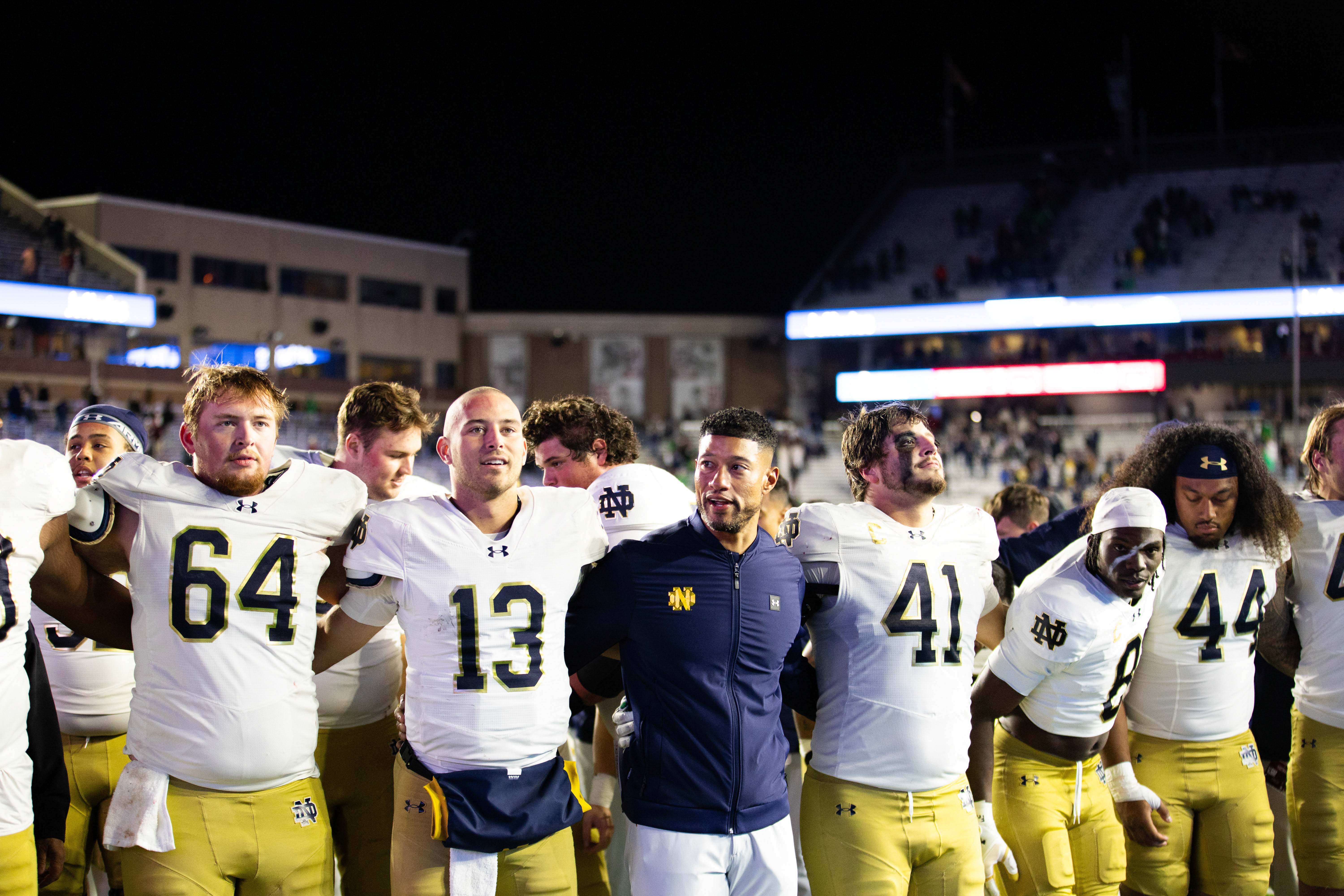 Nov 1, 2025; Chestnut Hill, Massachusetts, USA; Notre Dame Fighting Irish head coach Marcus Freeman, offensive lineman Joe Otting (64), safety Adon Shuler (8), defensive lineman Junior Tuihalamaka (44), quarterback CJ Carr (13) and defensive lineman Donovan Hinish (41) after the game against the Boston College Eagles at Alumni Stadium. Mandatory Credit: Edward Finan-Imagn Images