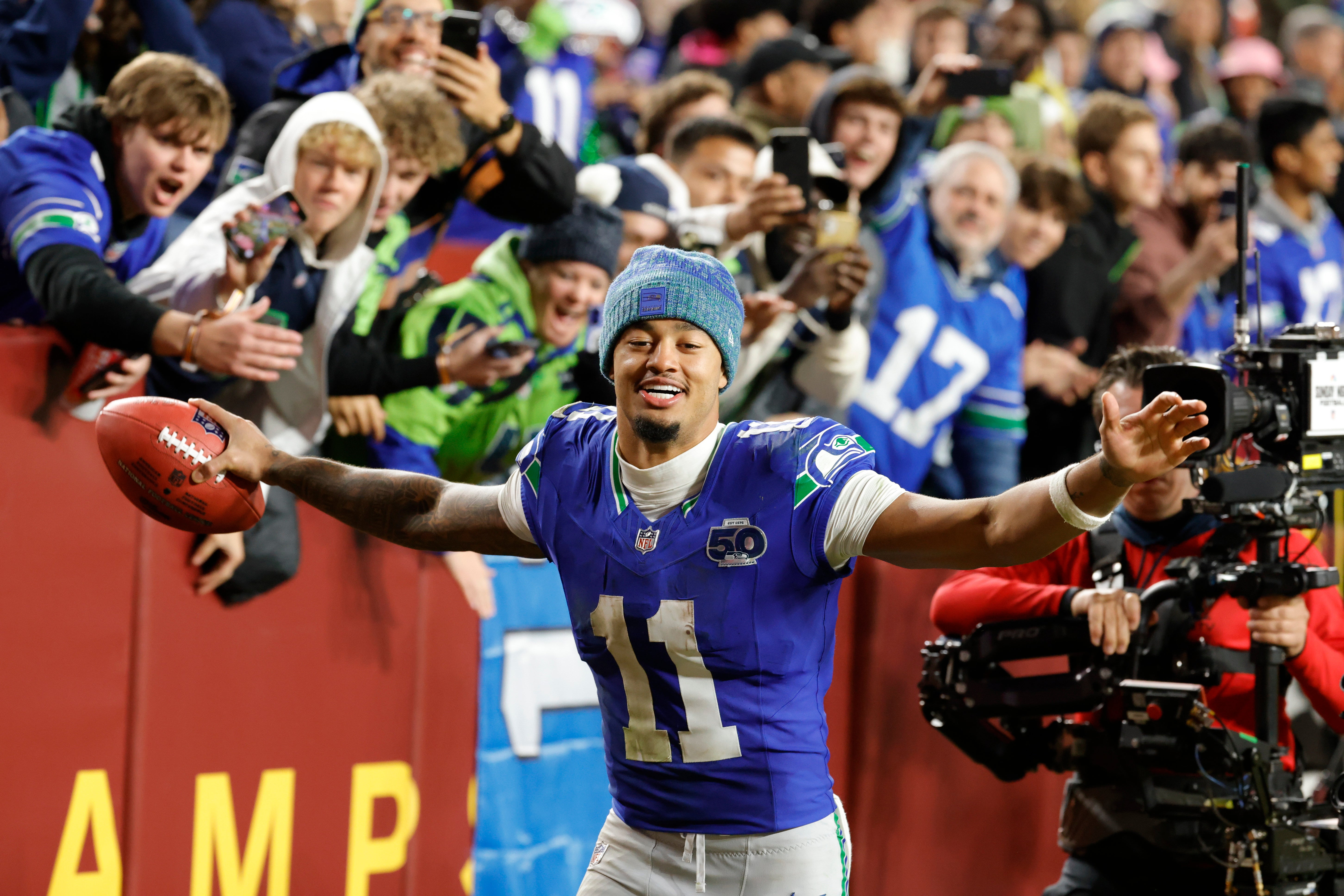 Seattle Seahawks wide receiver Jaxon Smith-Njigba (11) reacts to the win against the Washington Commanders