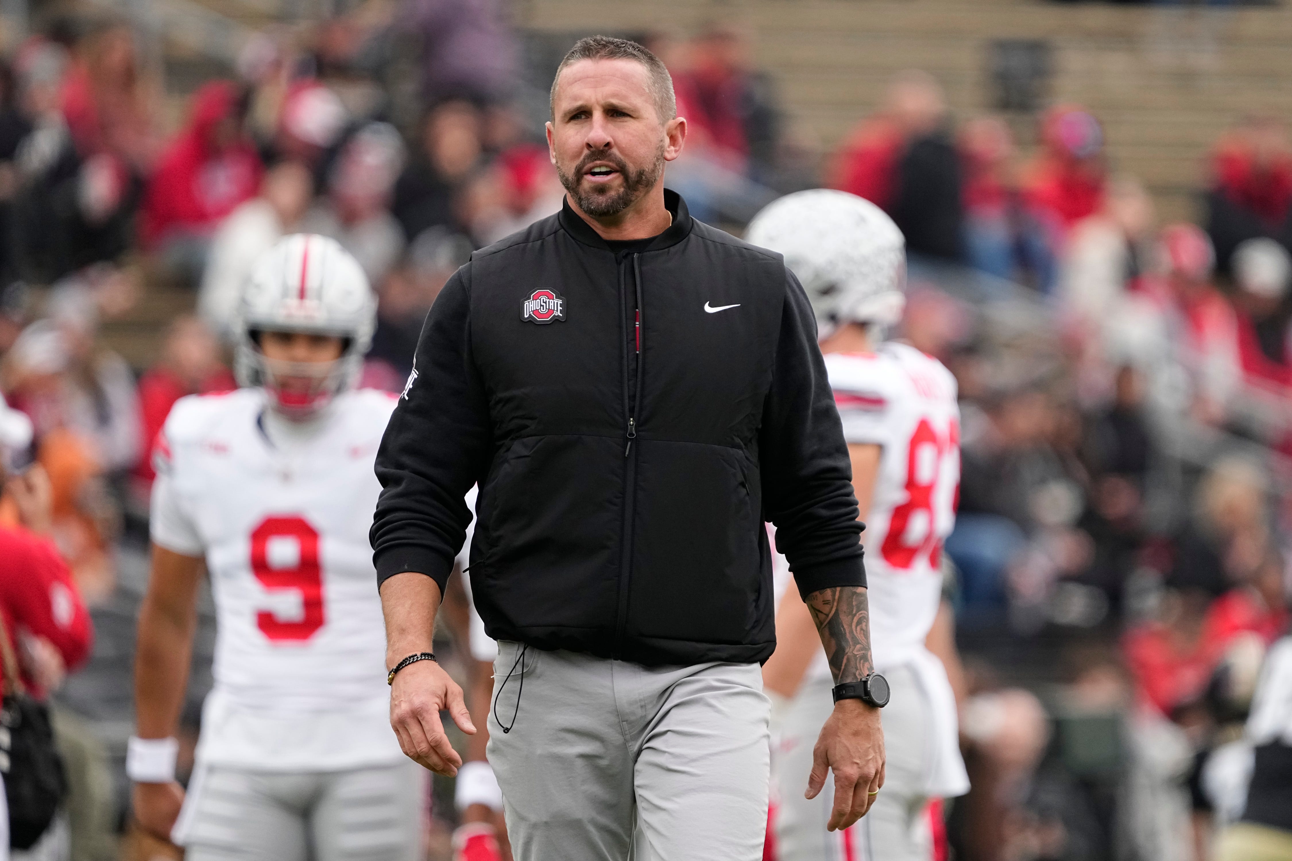 Ohio State Buckeyes defensive coordinator Brian Hartline leads warm ups prior to the NCAA football game against the Purdue Boilermakers at Ross-Ade Stadium in West Lafayette, Ind. on Nov. 8, 2025.
