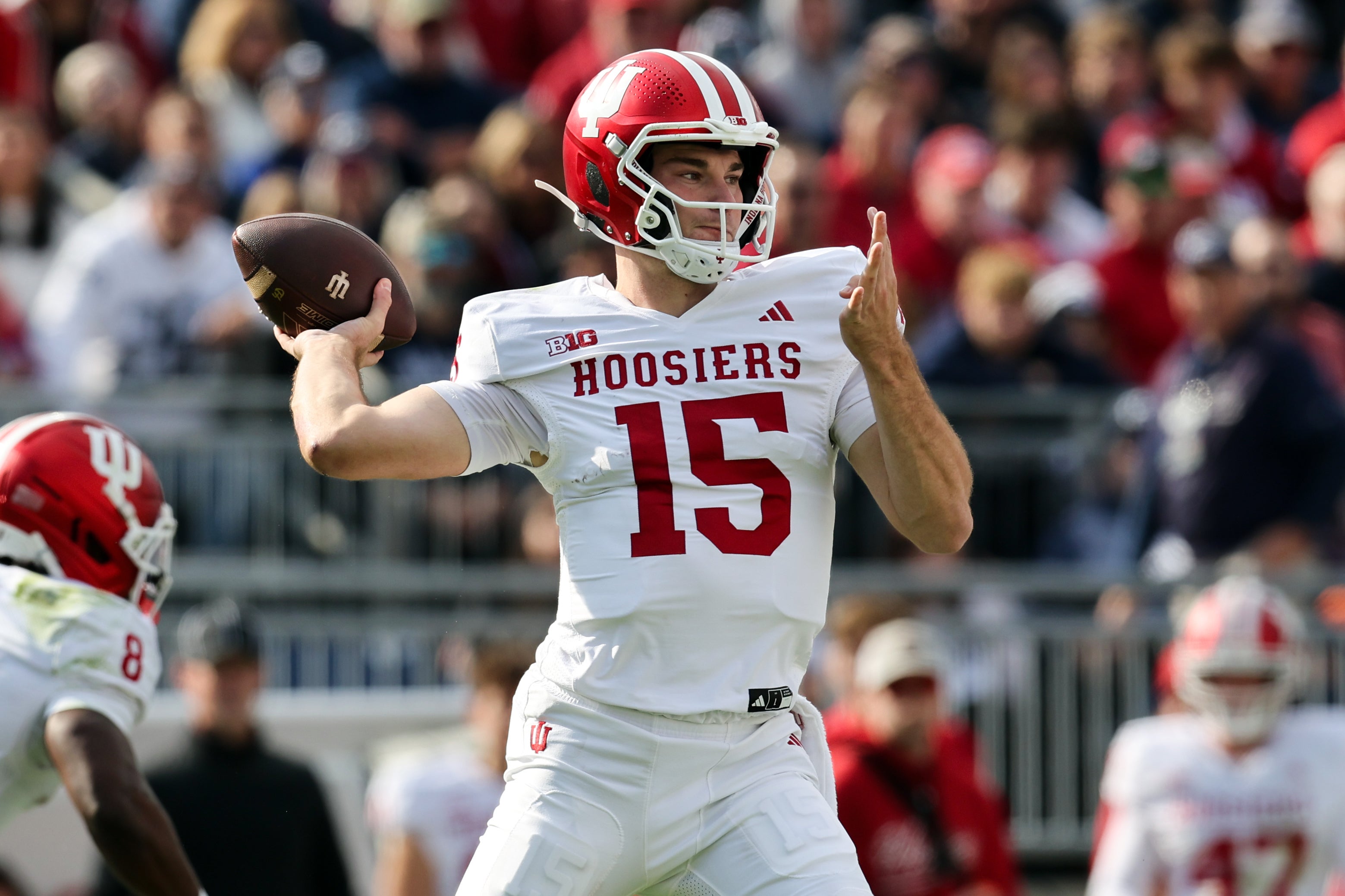 Nov 8, 2025; University Park, Pennsylvania, USA; Indiana Hoosiers quarterback Fernando Mendoza (15) throws a pass during the first quarter against the Penn State Nittany Lions at Beaver Stadium. Mandatory Credit: Matthew O'Haren-Imagn Images