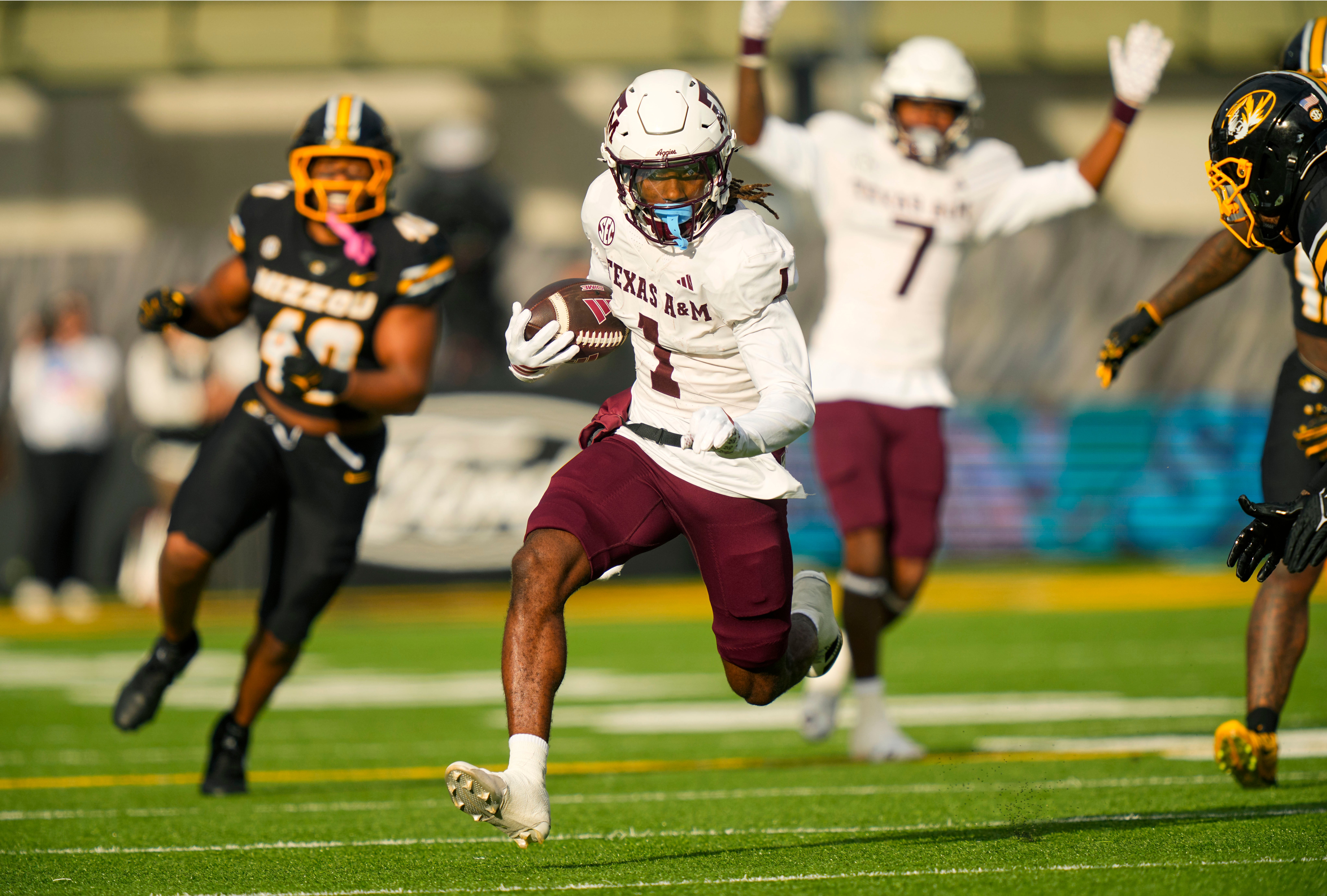 Nov 8, 2025; Columbia, Missouri, USA; Texas A&M Aggies wide receiver Mario Craver (1) runs with the ball during the first half against the Missouri Tigers at Faurot Field at Memorial Stadium.