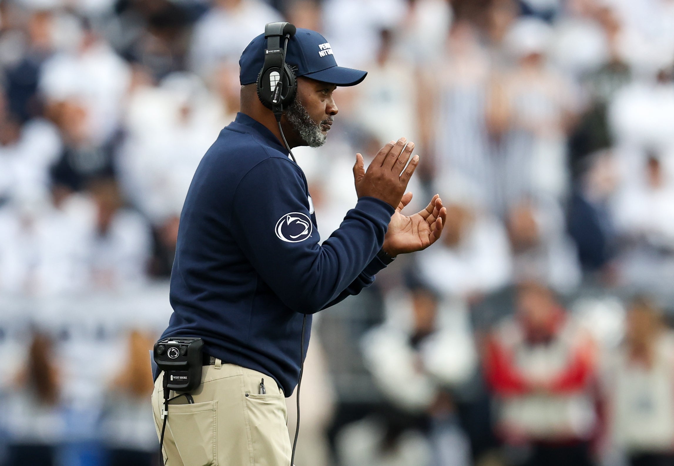 Nov 8, 2025; University Park, Pennsylvania, USA; Penn State Nittany Lions head coach Terry Smith celebrates from the sideline during the third quarter against the Indiana Hoosiers at Beaver Stadium. Mandatory Credit: Matthew O'Haren-Imagn Images