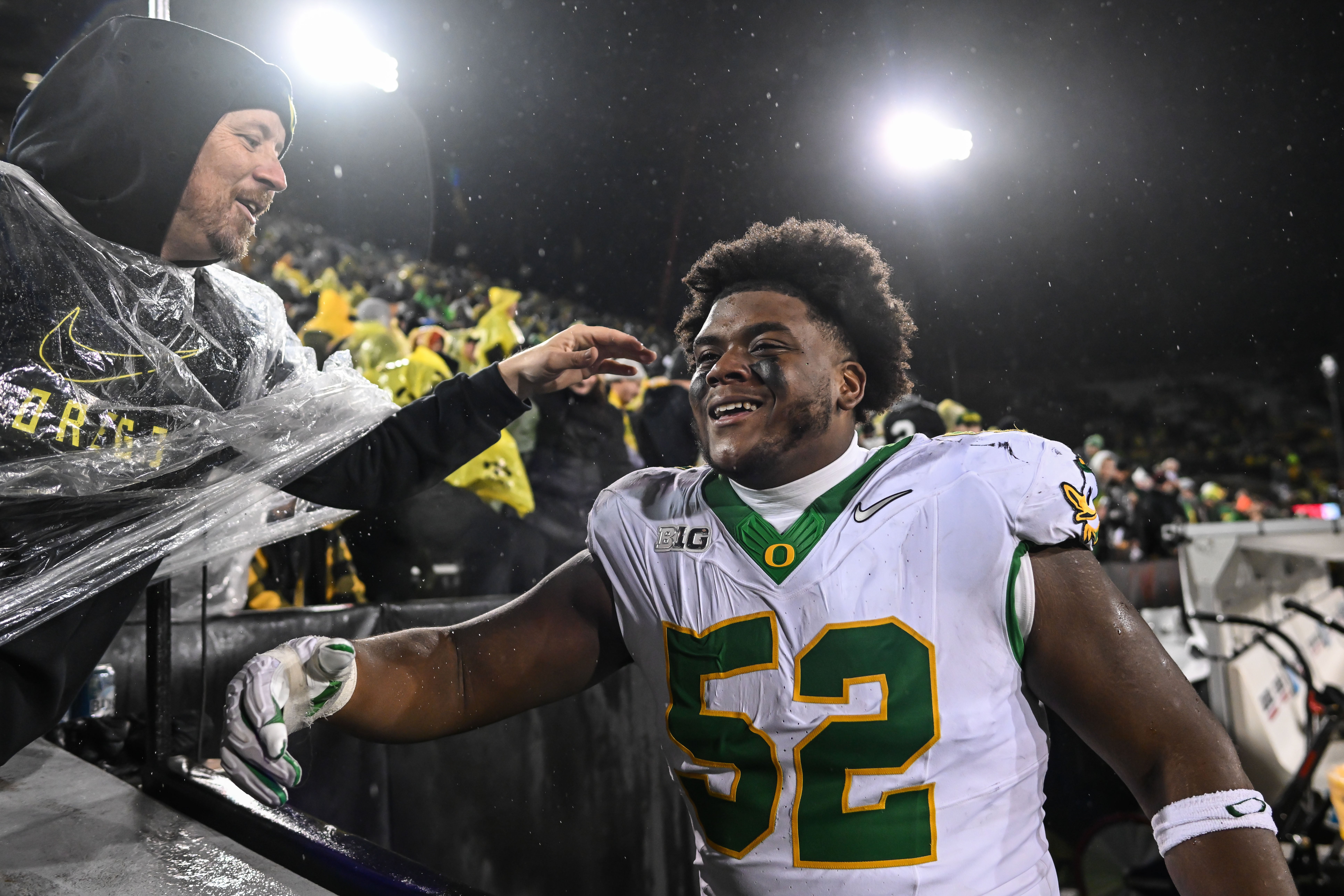 Nov 8, 2025; Iowa City, Iowa, USA; Oregon Ducks defensive lineman A'Mauri Washington (52) reacts with fans after the game against the Iowa Hawkeyes at Kinnick Stadium. Mandatory Credit: Jeffrey Becker-Imagn Images