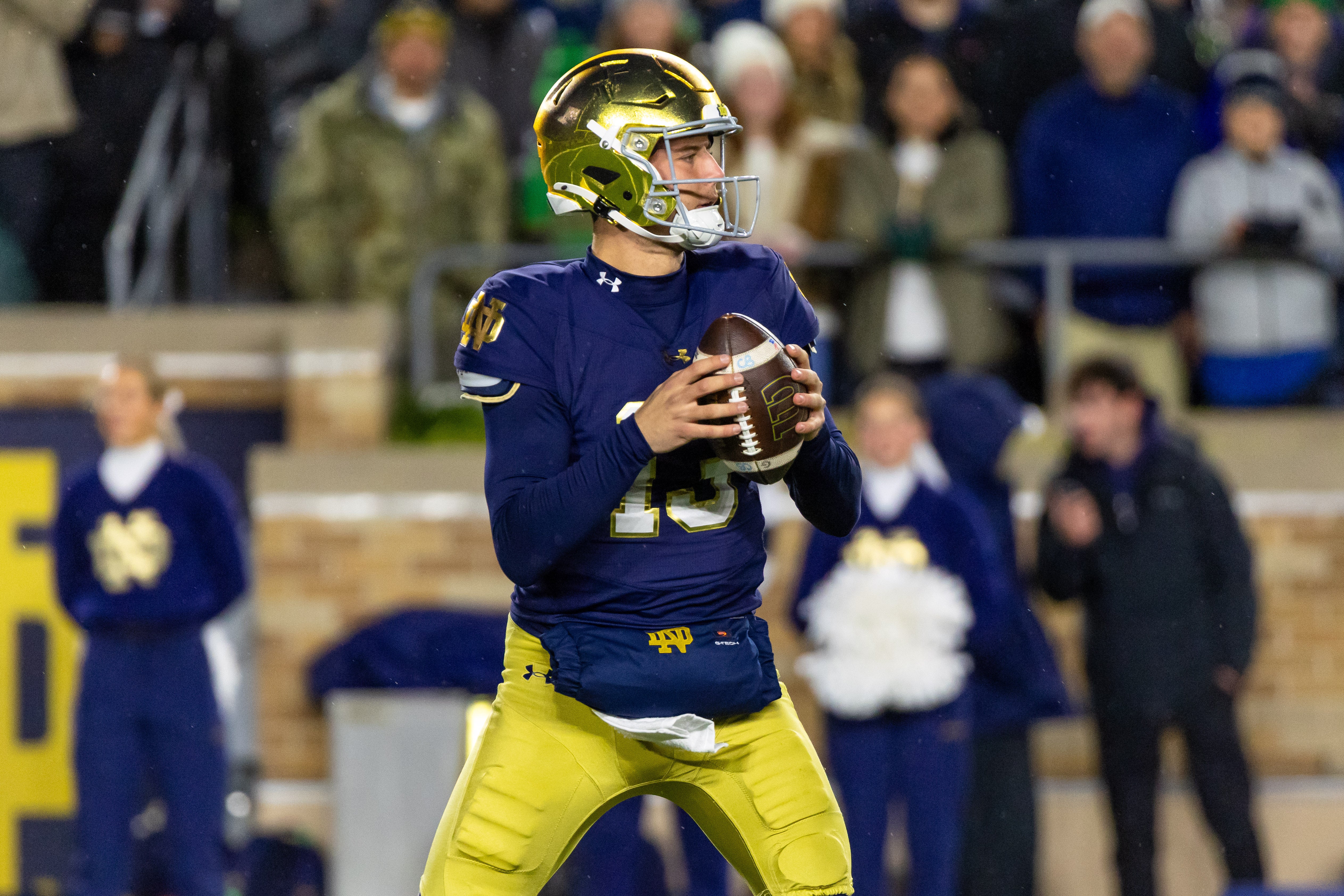 Nov 8, 2025; South Bend, Indiana, USA; Notre Dame Fighting Irish quarterback CJ Carr (13) looks to pass against the Navy Midshipmen during the first half at Notre Dame Stadium. Mandatory Credit: Michael Caterina-Imagn Images