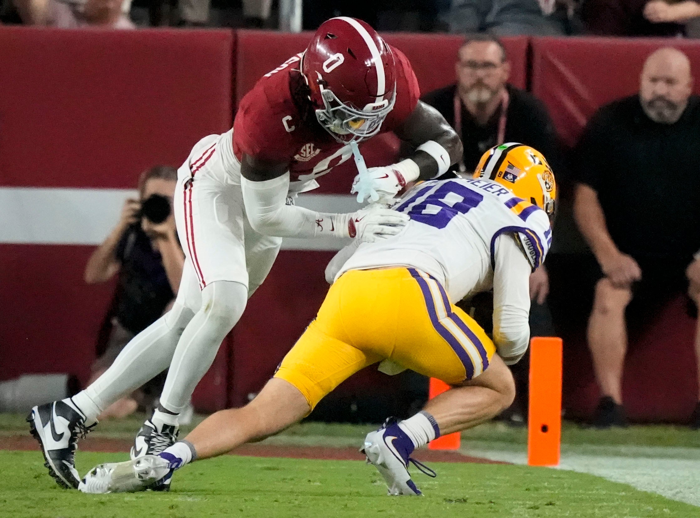 Nov 8, 2025; Tuscaloosa, Alabama, USA; Alabama linebacker Deontae Lawson (0) makes a tackle on LSU quarterback Garrett Nussmeier (18) at Saban Field at Bryant-Denny Stadium.