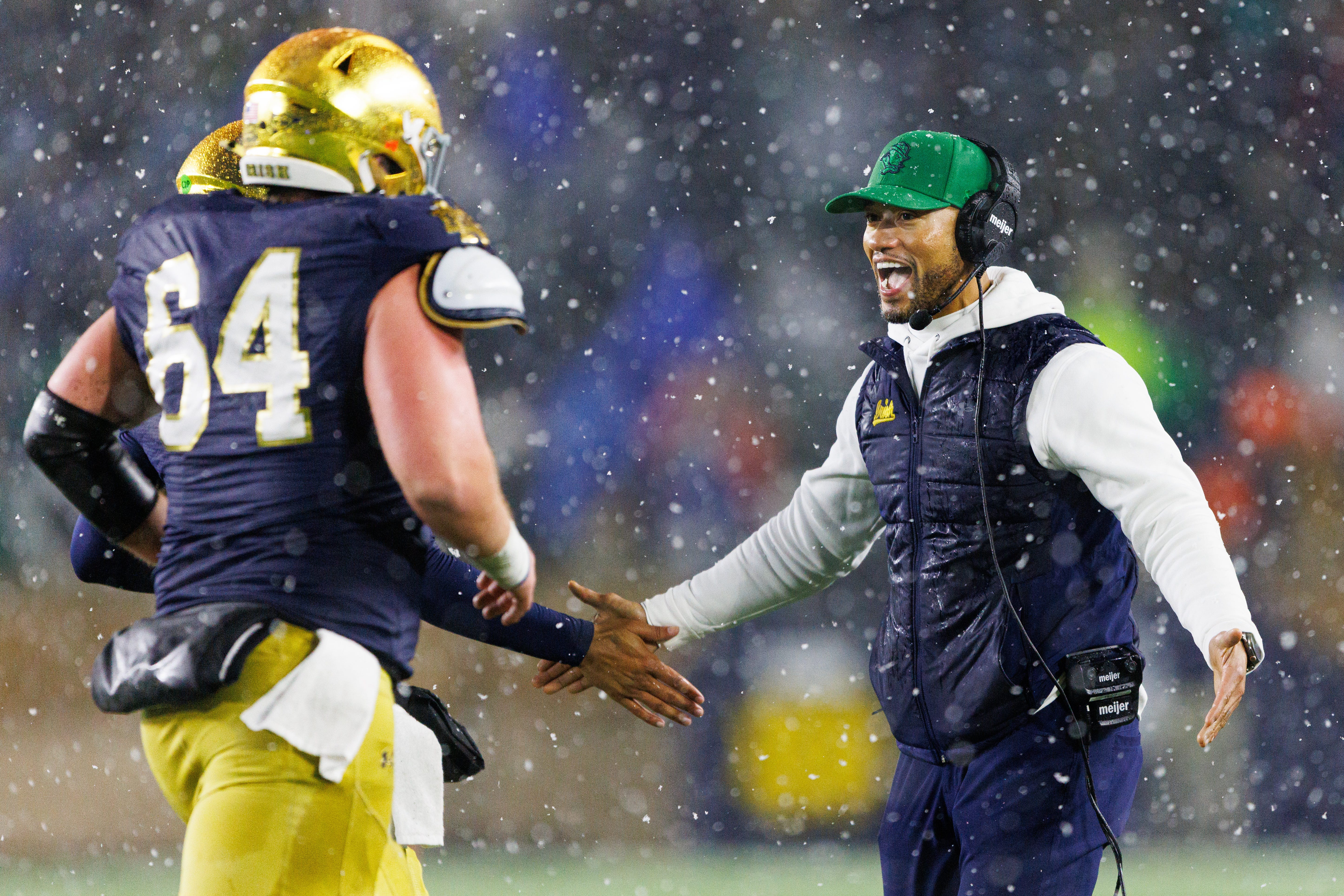 Notre Dame head coach Marcus Freeman, right, celebrates after a touchdown during the second half of a NCAA football game against Navy at Notre Dame Stadium on Saturday, Nov. 8, 2025, in South Bend.