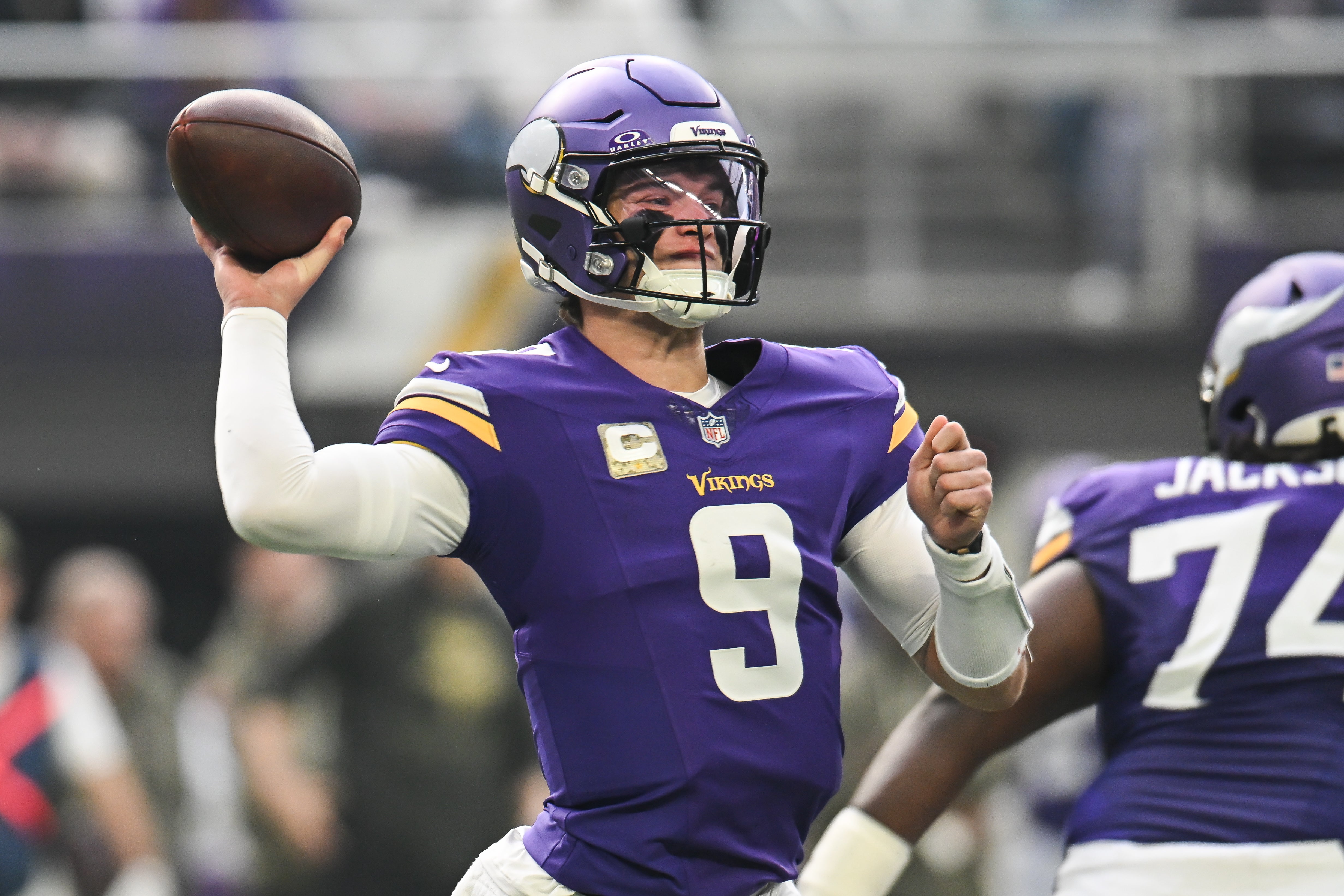 Nov 9, 2025; Minneapolis, Minnesota, USA; Minnesota Vikings quarterback J.J. McCarthy (9) throws a pass against the Baltimore Ravens during the first quarter at U.S. Bank Stadium.