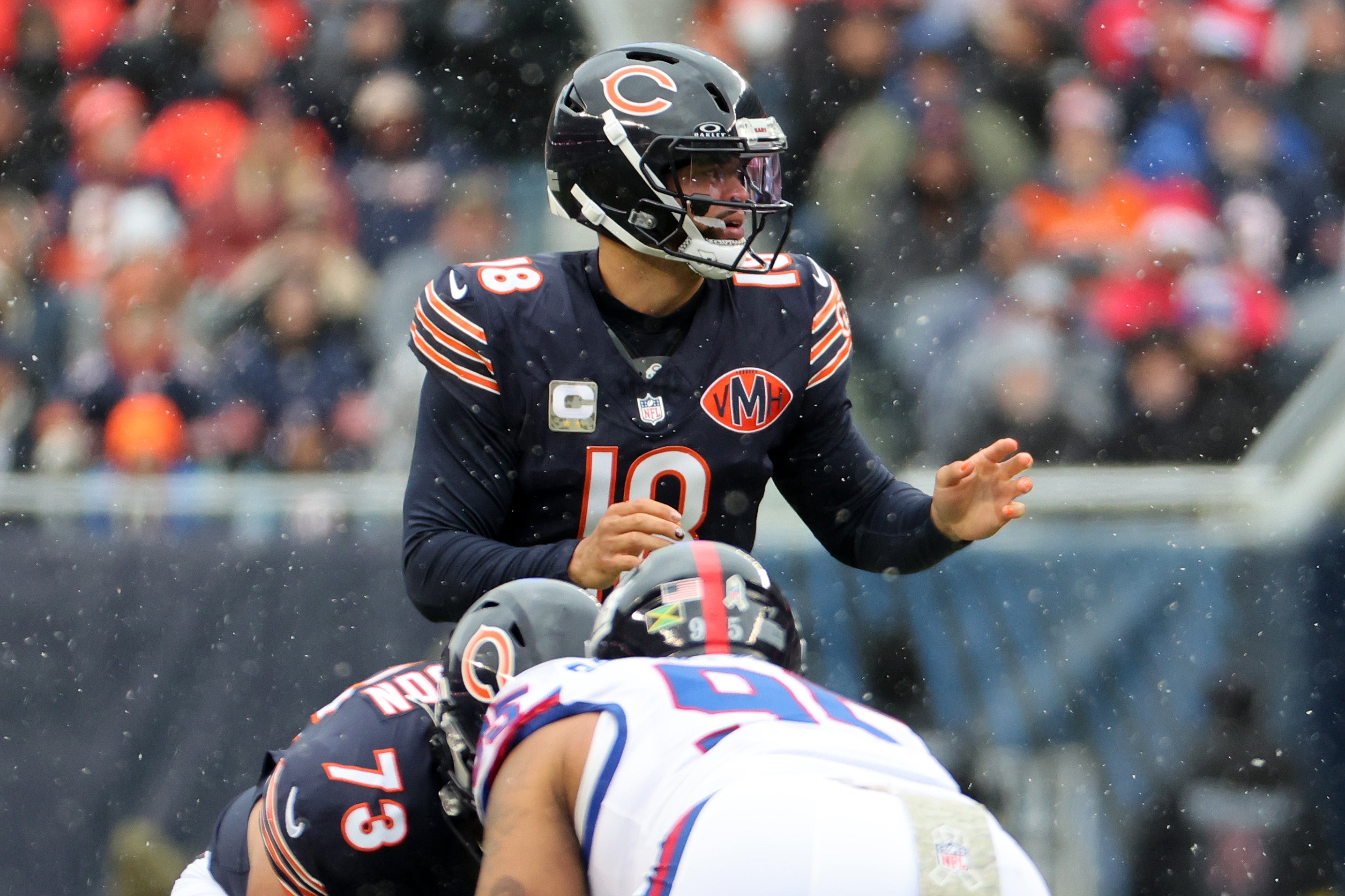 Nov 9, 2025; Chicago, Illinois, USA; Chicago Bears quarterback Caleb Williams (18) reacts against the New York Giants during the first half at Soldier Field.