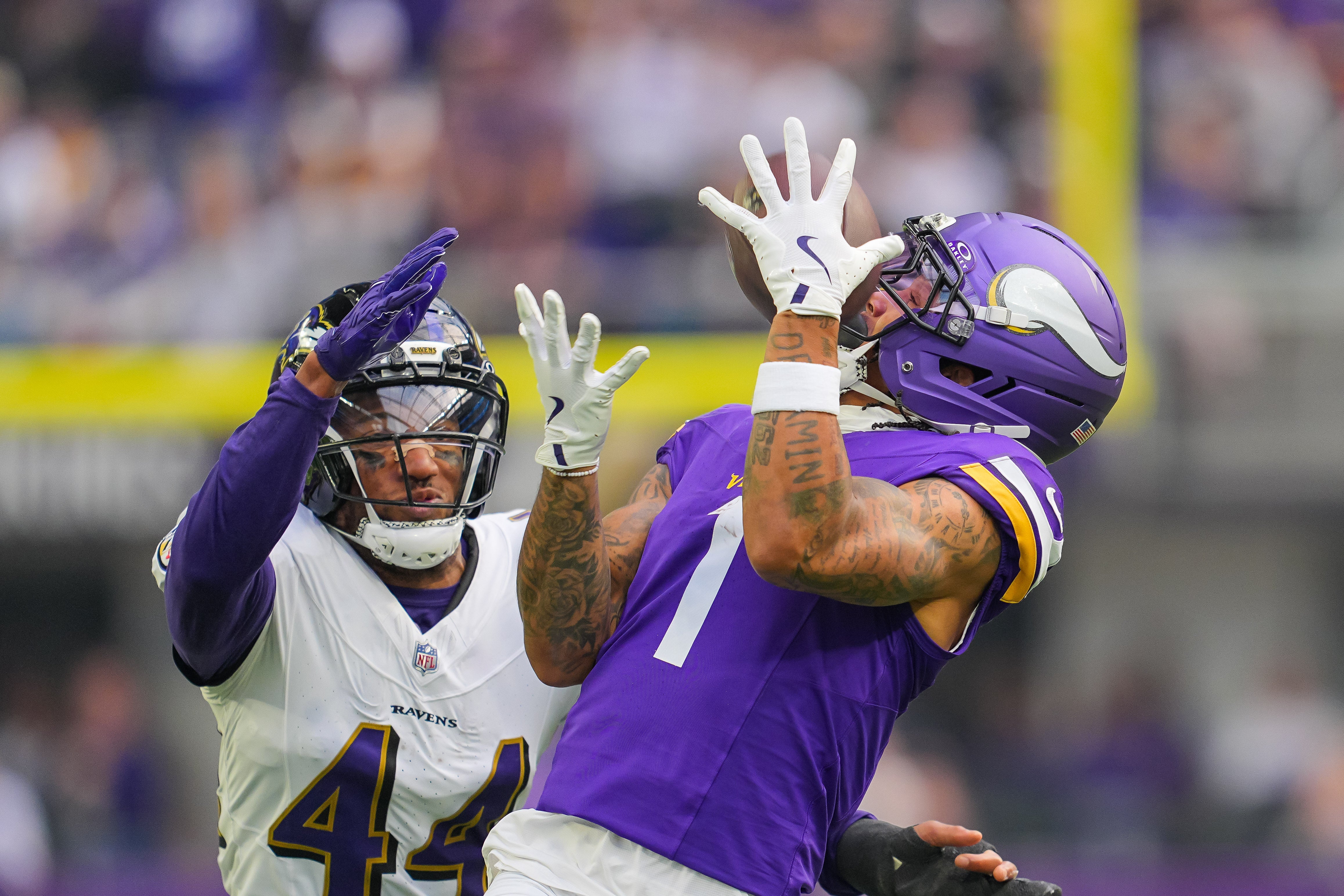 Nov 9, 2025; Minneapolis, Minnesota, USA; Minnesota Vikings wide receiver Jalen Nailor (1) catches a pass against Baltimore Ravens cornerback Marlon Humphrey (44) in the first quarter at U.S. Bank Stadium.
