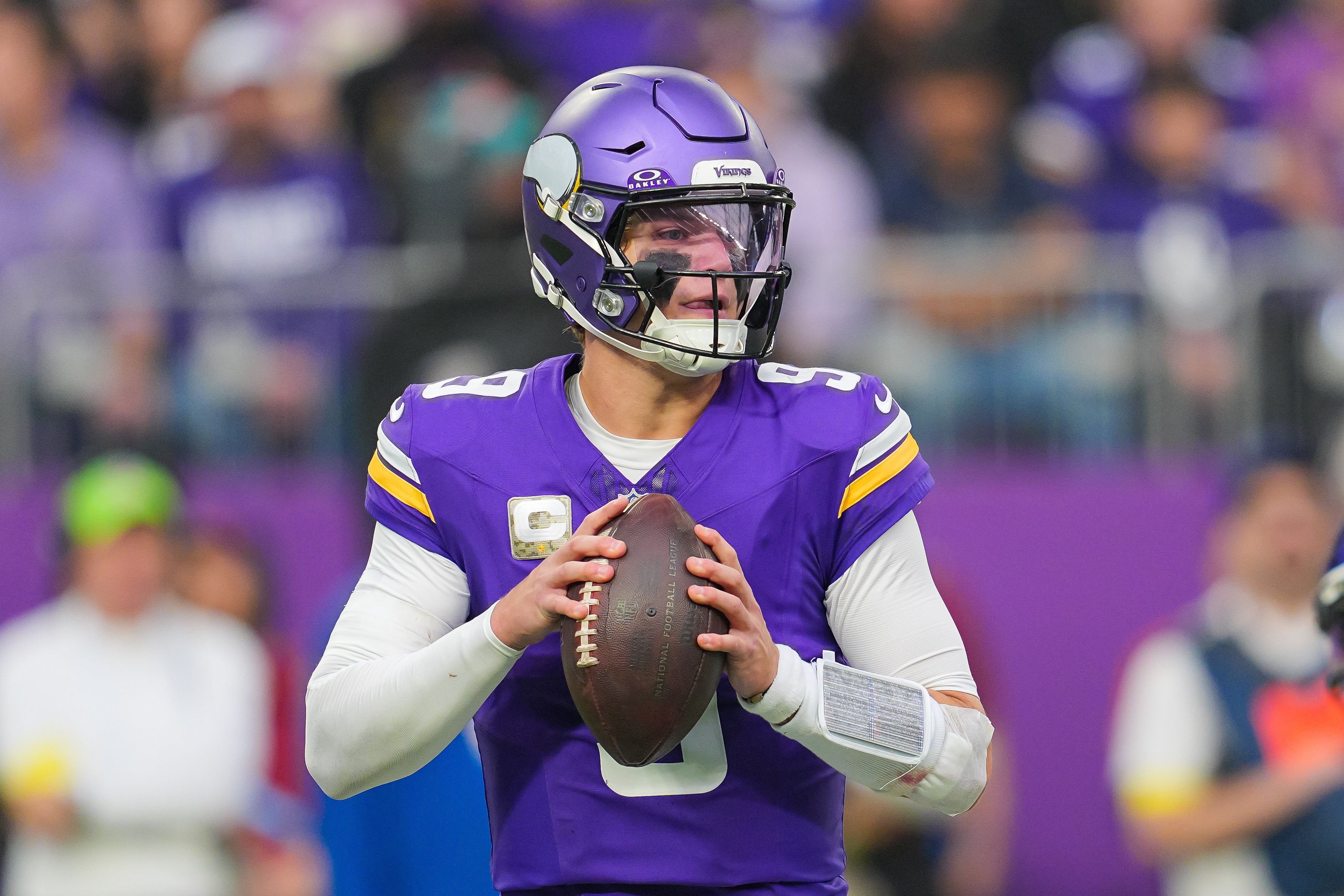 Nov 9, 2025; Minneapolis, Minnesota, USA; Minnesota Vikings quarterback J.J. McCarthy (9) drops back to pass against the Baltimore Ravens in the second quarter at U.S. Bank Stadium.