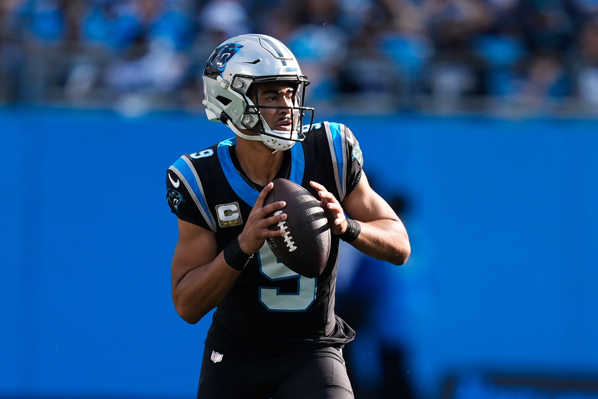 Nov 9, 2025; Charlotte, North Carolina, USA; Carolina Panthers quarterback Bryce Young (9) looks to pass during the third quarter against the New Orleans Saints at Bank of America Stadium.