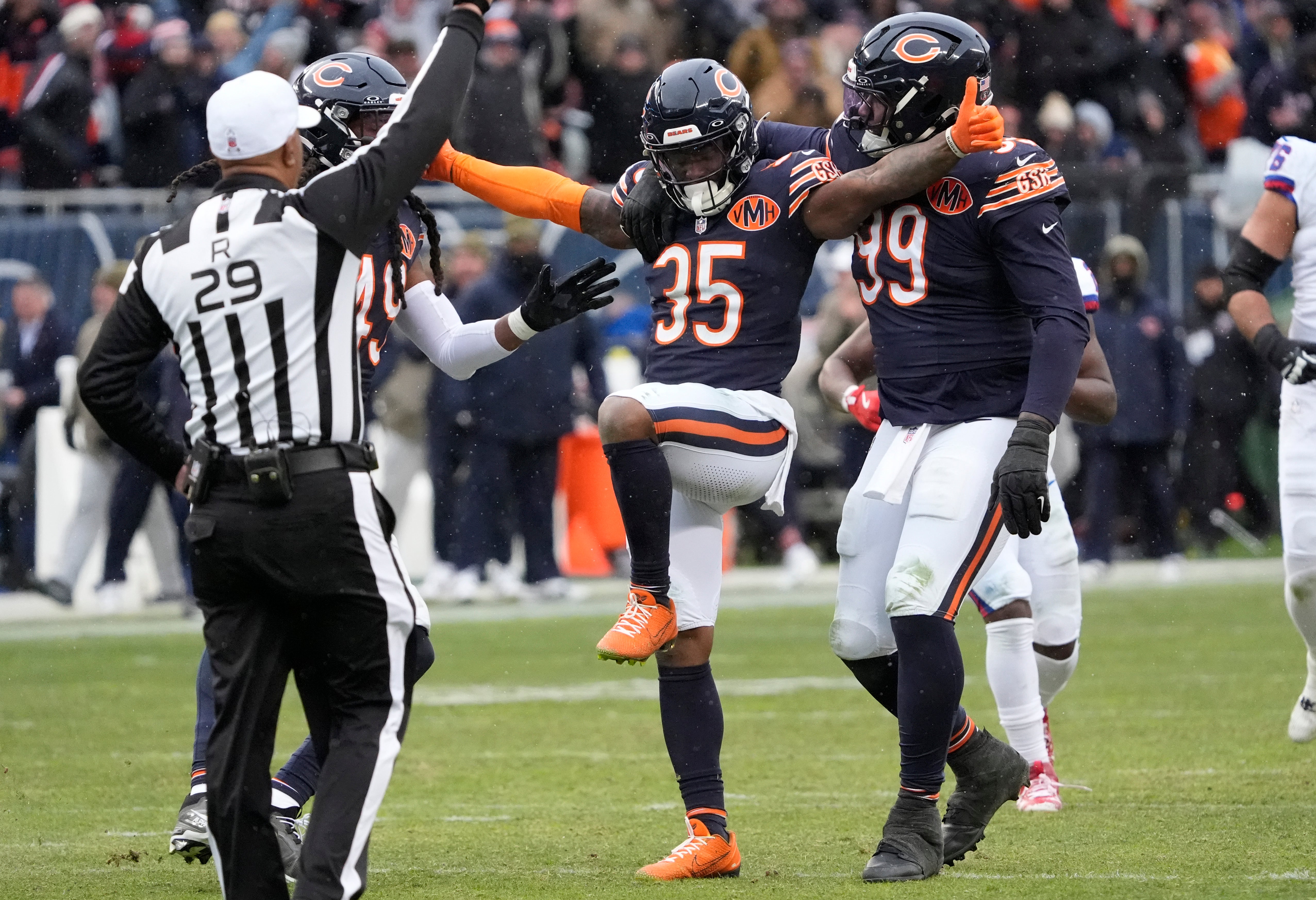Nov 9, 2025; Chicago, Illinois, USA; Chicago Bears safety C.J. Gardner-Johnson (35) celebrates with defensive tackle Gervon Dexter Sr. (99) after a sack during the second half against the New York Giants at Soldier Field.