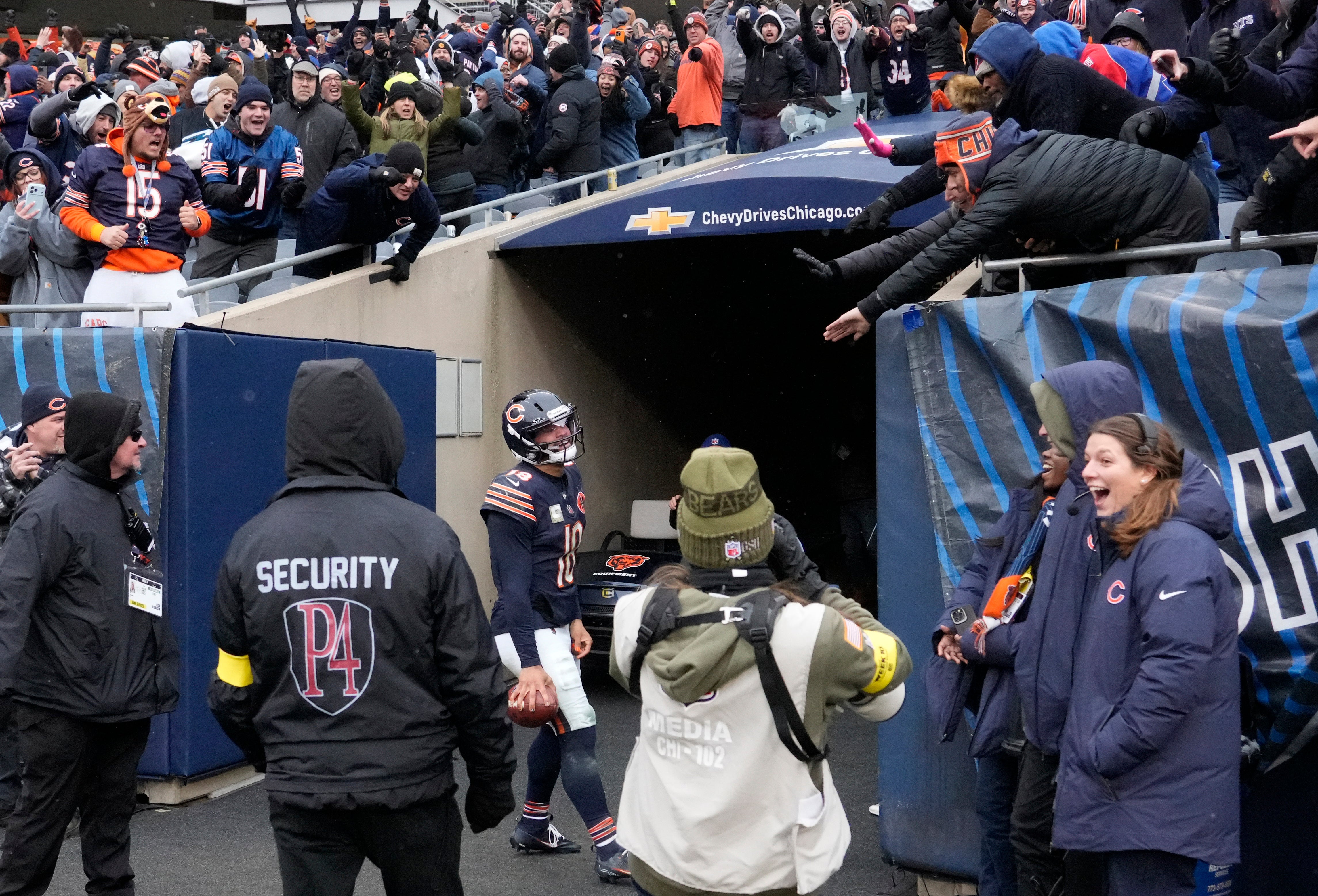 Nov 9, 2025; Chicago, Illinois, USA; Chicago Bears quarterback Caleb Williams (18) celebrates after scoring the game-winning touchdown against New York Giants during the fourth quarter at Soldier Field.