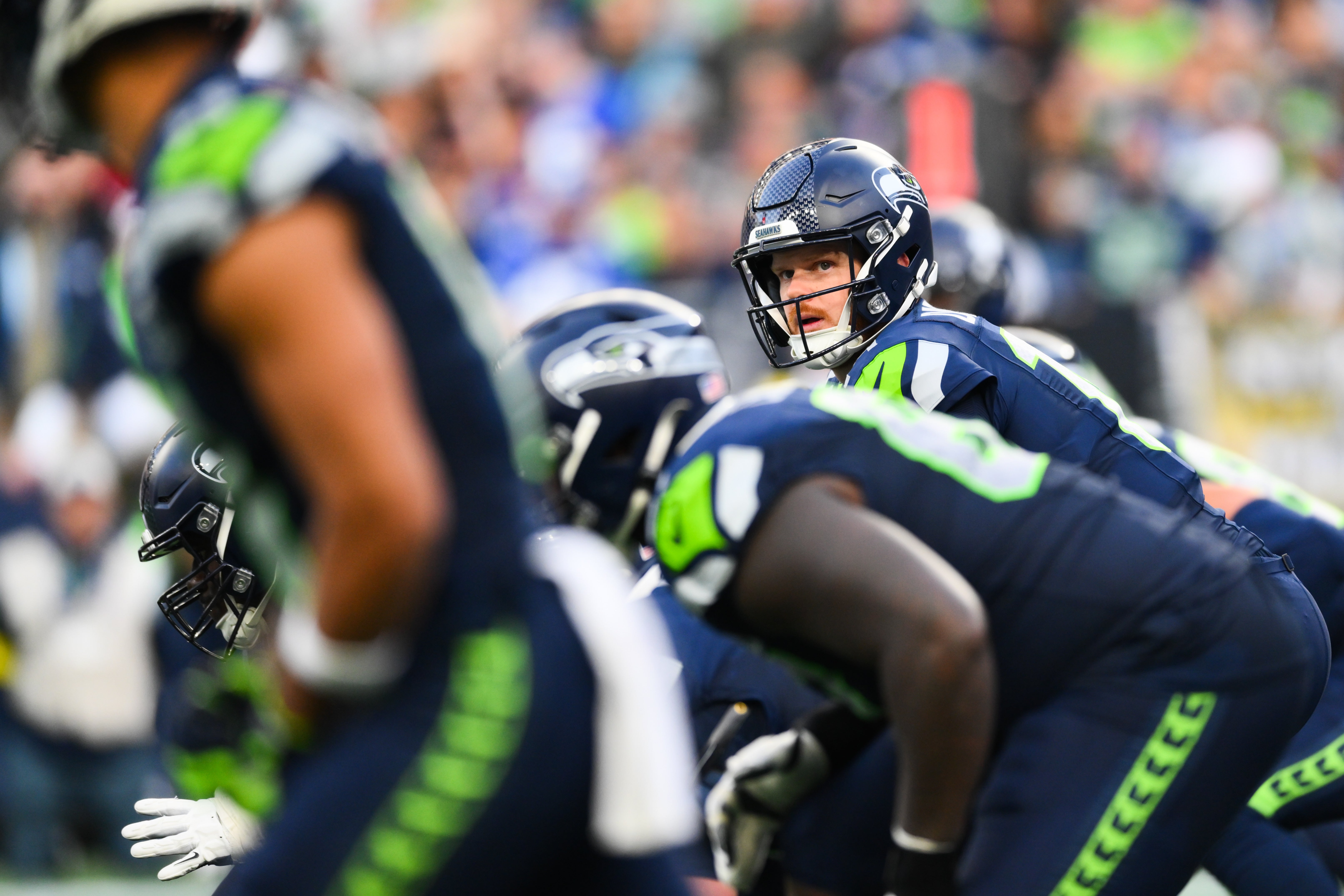 Nov 9, 2025; Seattle, Washington, USA; Seattle Seahawks quarterback Sam Darnold (14) prepares to take a snap during the third quarter against the Arizona Cardinals at Lumen Field.