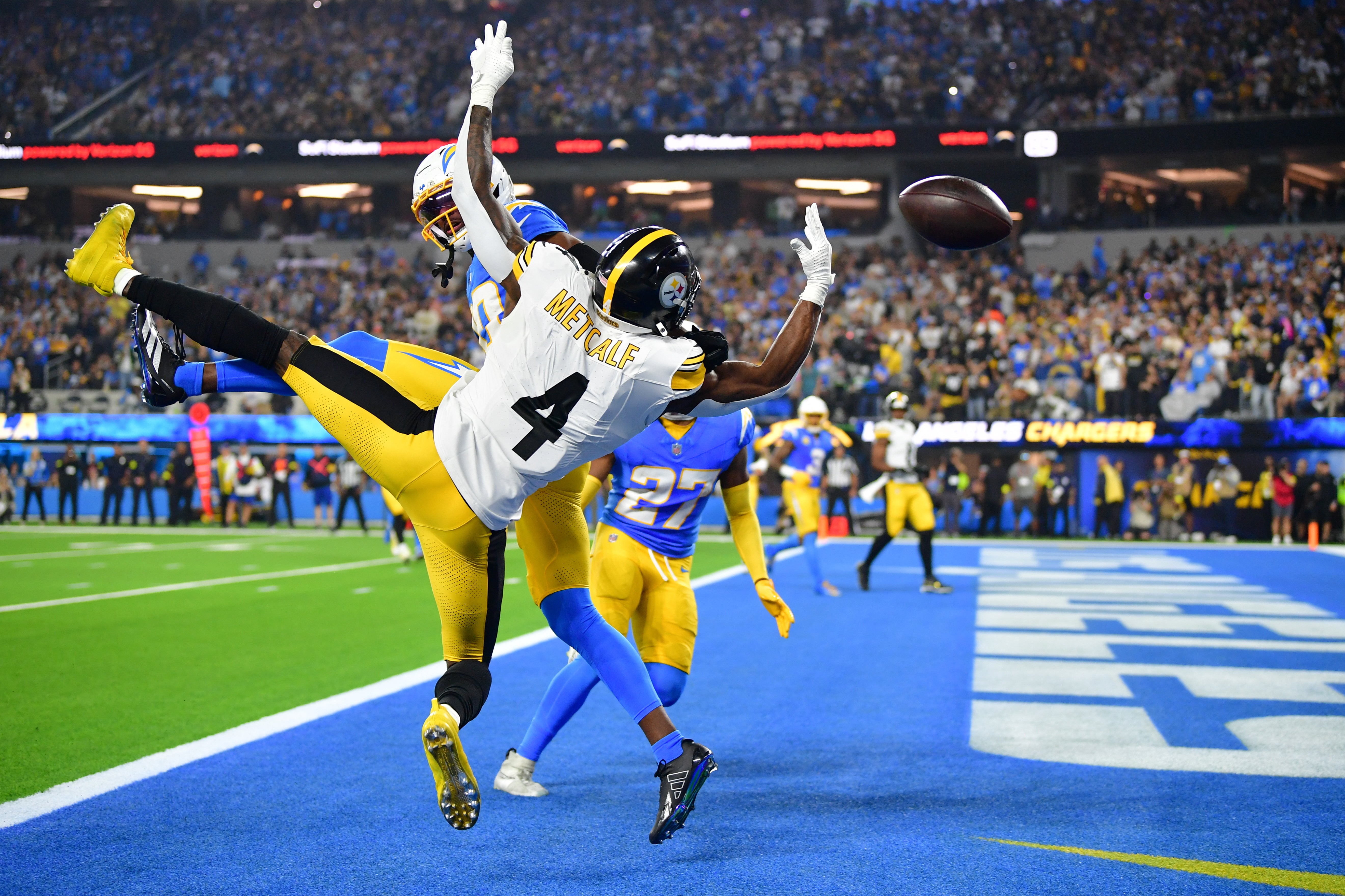 Nov 9, 2025; Inglewood, California, USA; Los Angeles Chargers cornerback Cam Hart (20) breaks up a touchdown pass intended for Pittsburgh Steelers wide receiver DK Metcalf (4) during the fourth quarter of the game at SoFi Stadium