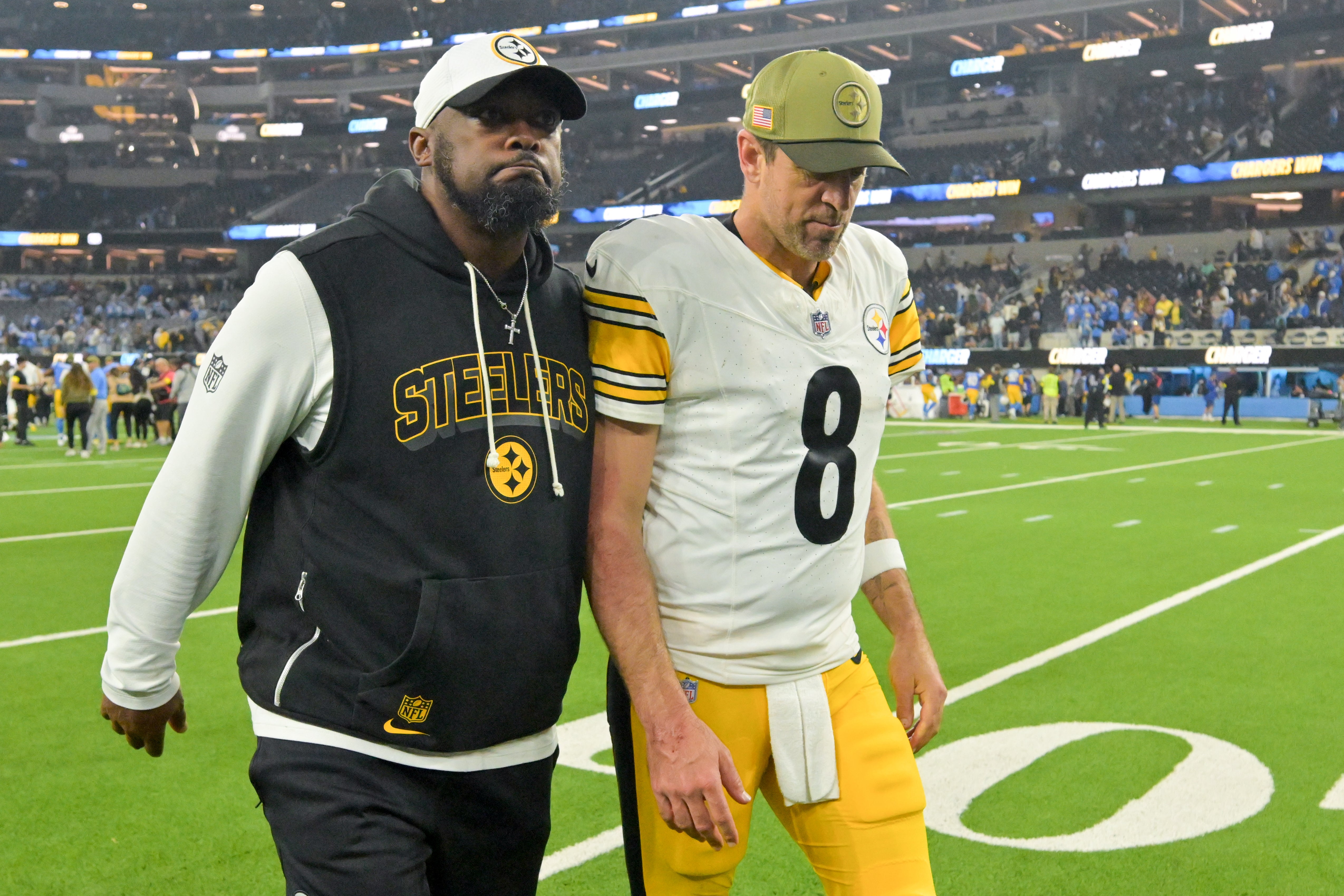 Nov 9, 2025; Inglewood, California, USA; Pittsburgh Steelers head coach Mike Tomlin and quarterback Aaron Rodgers (8) walk off the field after the game against the Los Angeles Chargers at SoFi Stadium.