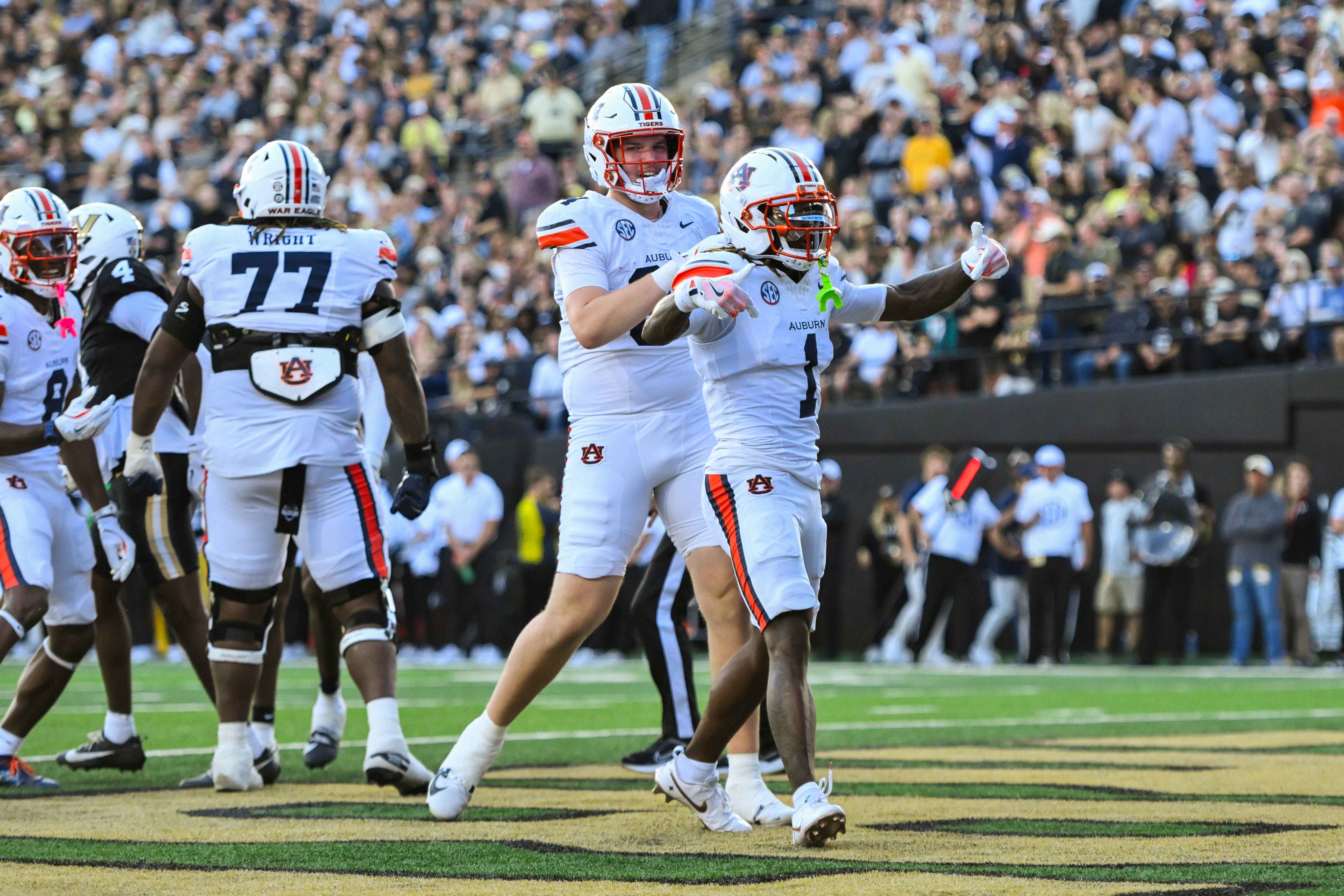 Nov 8, 2025; Nashville, Tennessee, USA; Auburn Tigers wide receiver Eric Singleton Jr. (1) celebrates with his teammates after scoring a touchdown against the Vanderbilt Commodores during the first half at FirstBank Stadium. Mandatory Credit: Steve Roberts-Imagn Images