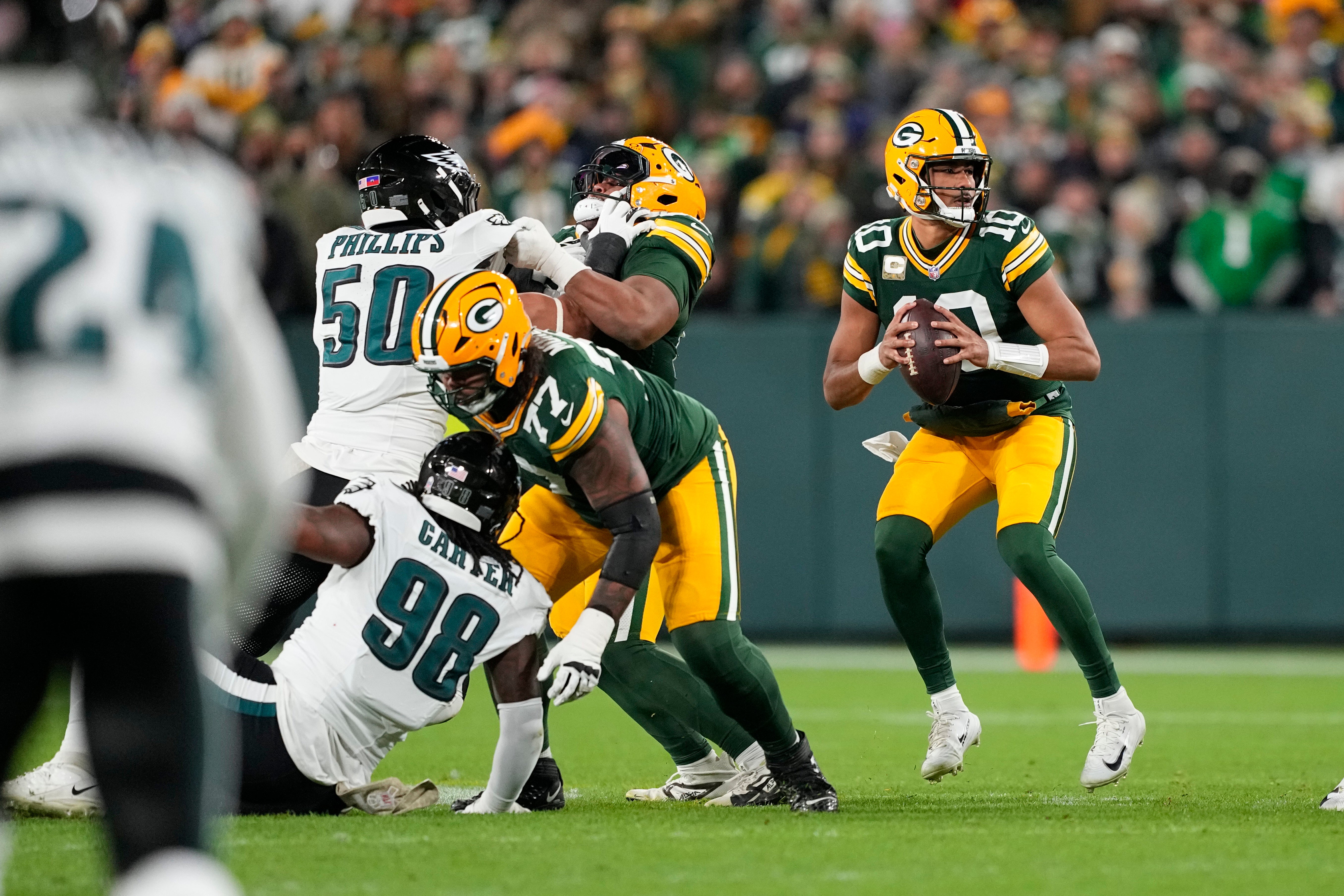 Nov 10, 2025; Green Bay, Wisconsin, USA; Green Bay Packers quarterback Jordan Love (10) stands in the pocket against the Philadelphia Eagles in the first half at Lambeau Field.