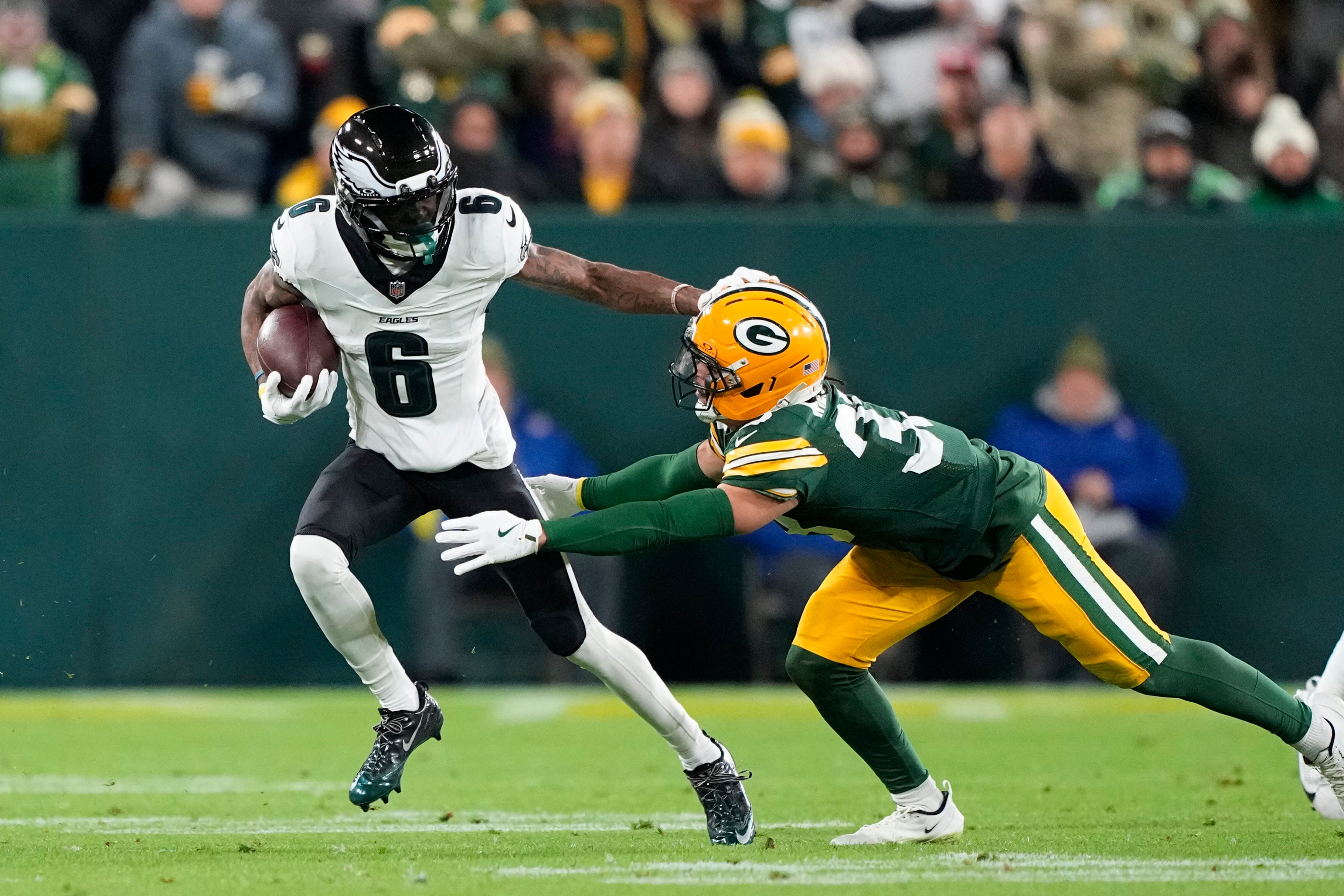 Philadelphia Eagles wide receiver DeVonta Smith (6) runs after the catch against the Green Bay Packers in the first half at Lambeau Field.