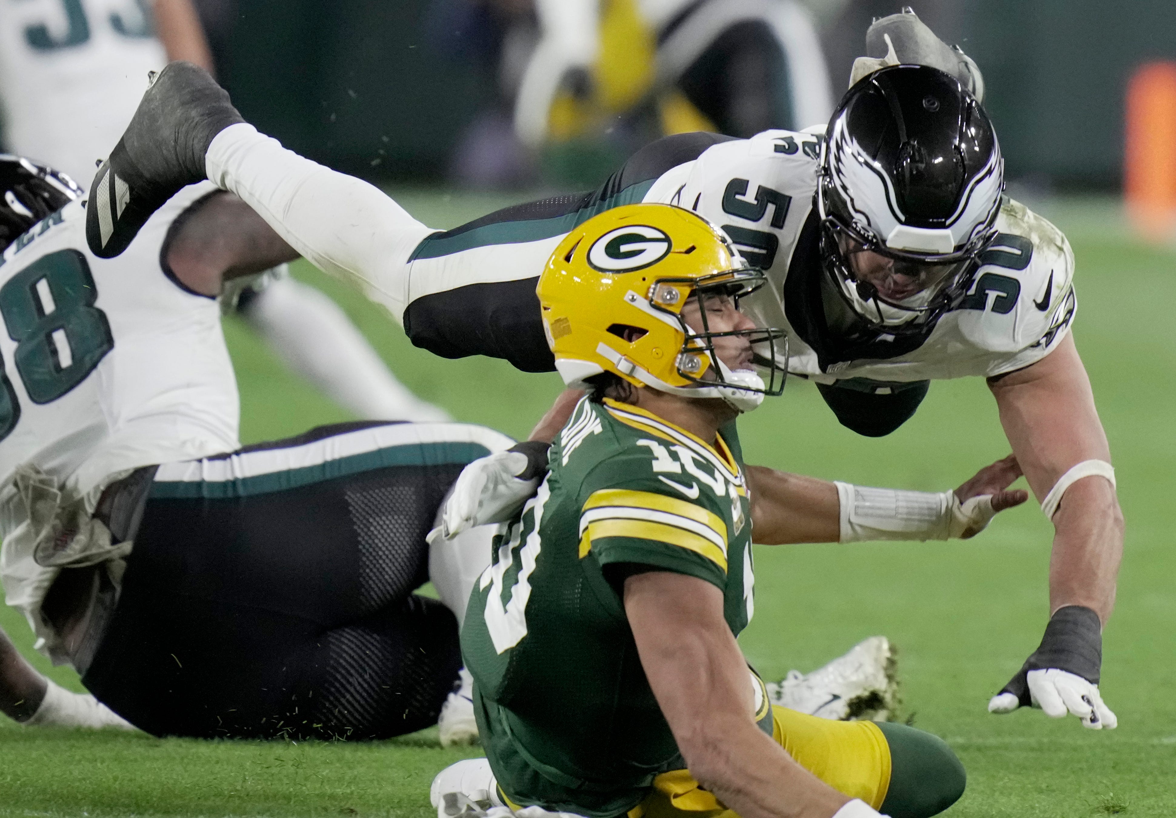 Philadelphia Eagles linebacker Jaelan Phillips (50) pressures Green Bay Packers quarterback Jordan Love (10) during the fourth quarter of their game Monday, November 10, 2025 at Lambeau Field in Green.