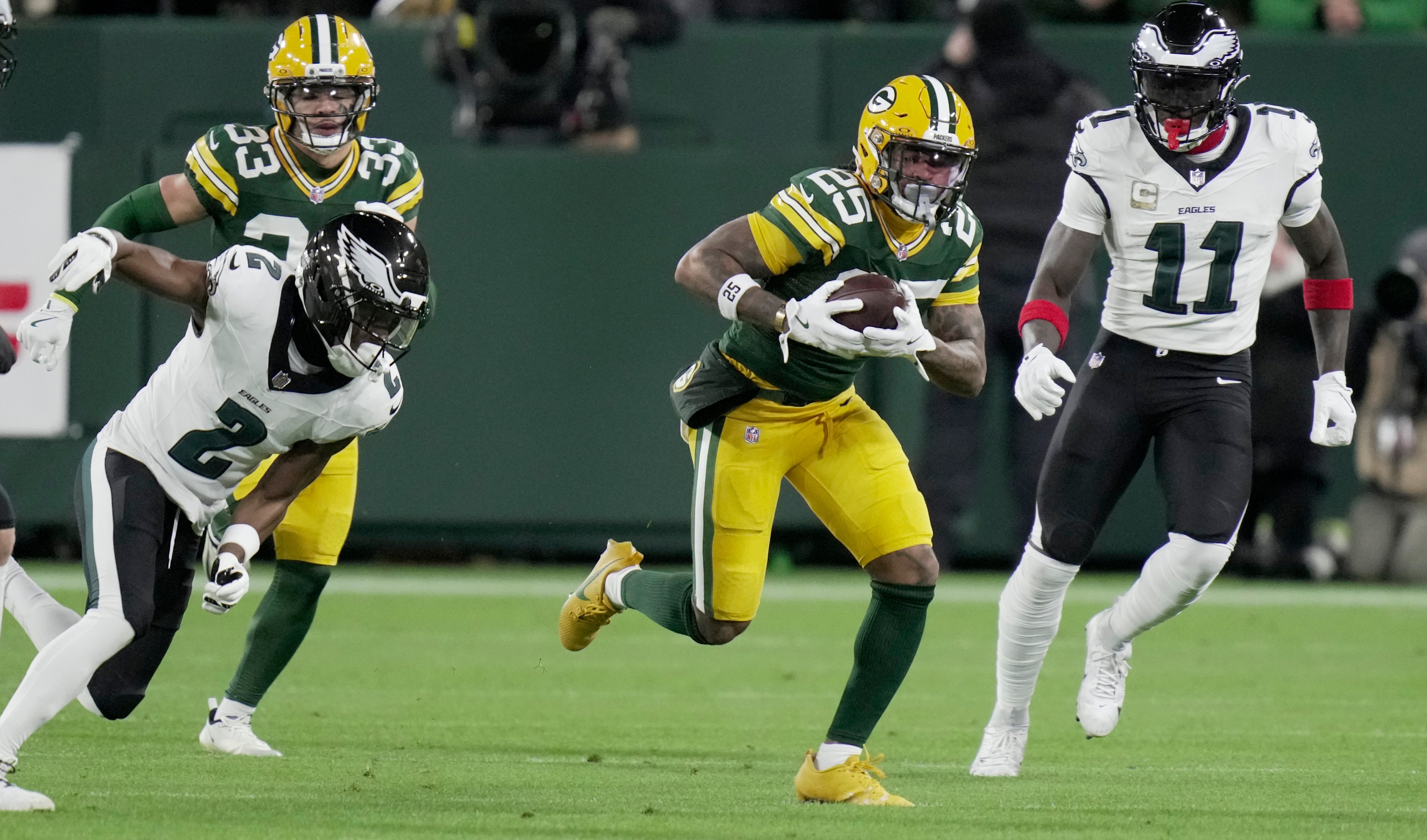 Nov 10, 2025; Green Bay, Wisconsin, USA; Green Bay Packers cornerback Keisean Nixon (25) recovers a fumble by Philadelphia Eagles quarterback Jalen Hurts during the first half at Lambeau Field.