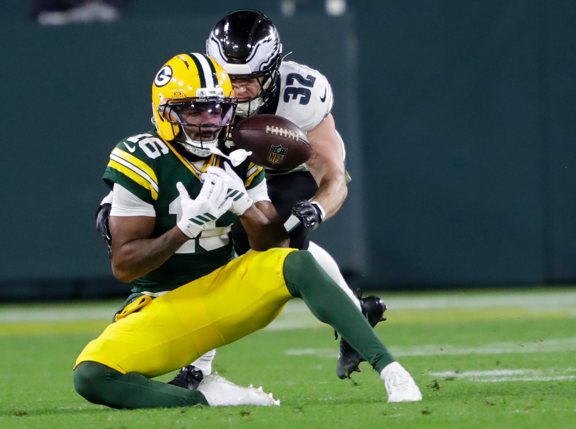 Green Bay Packers cornerback Bo Melton (16) drops a pass against Philadelphia Eagles safety Reed Blankenship (32) in the third quarter during their football game Monday, November 10, 2025, at Lambeau Field in Green Bay, Wisconsin. The Eagles took over on downs.