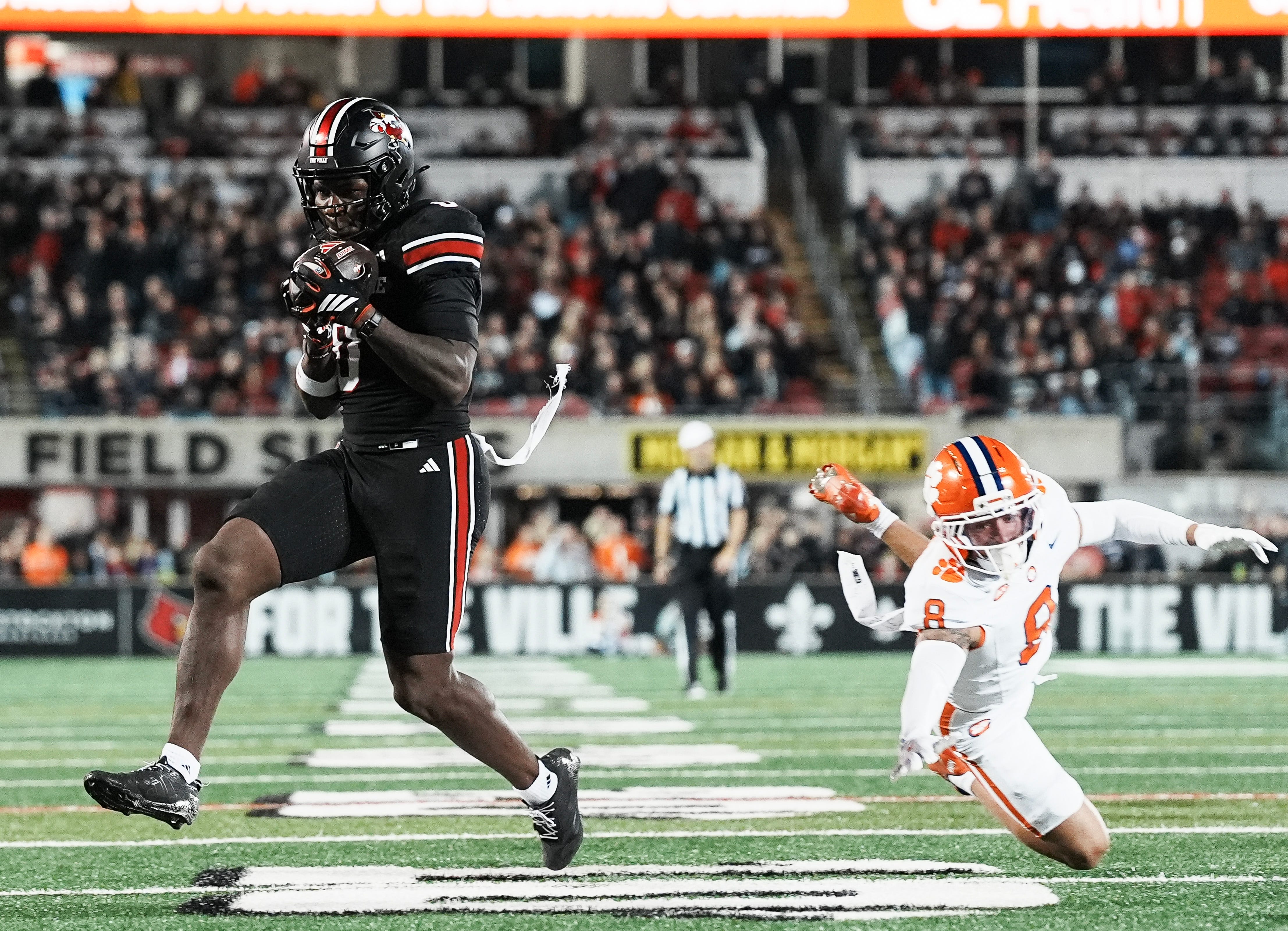 Louisville Cardinals wide receiver Chris Bell (0) got close to the end zone but officials ruled against his touchdown after a replay review as the Cards take on Clemson in the first half at L&N Stadium Friday, Nov. 14, 2025.