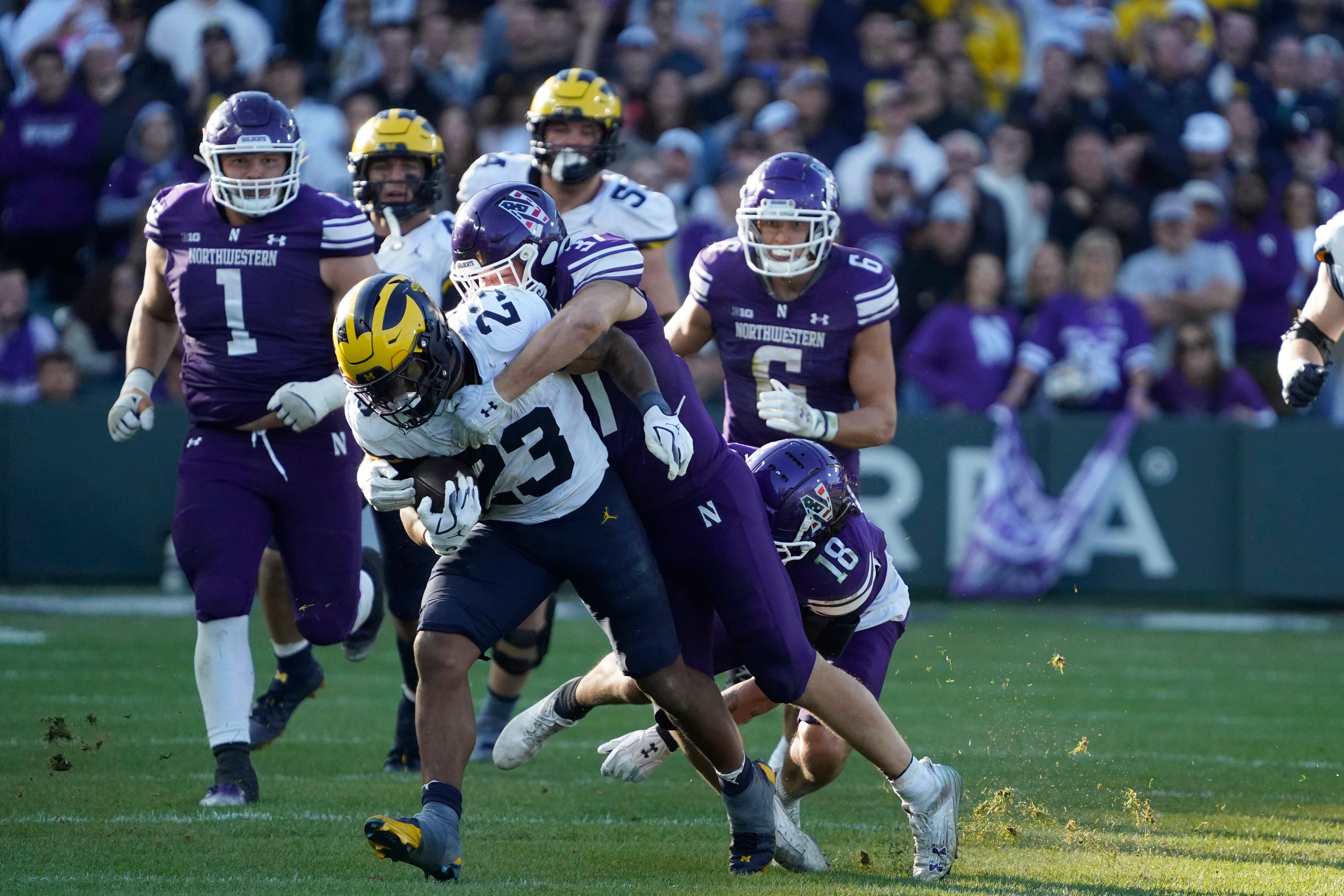 Nov 15, 2025; Chicago, Illinois, USA; Michigan Wolverines running back Jordan Marshall (23) runs against the Northwestern Wildcats during the second half at Wrigley Field.