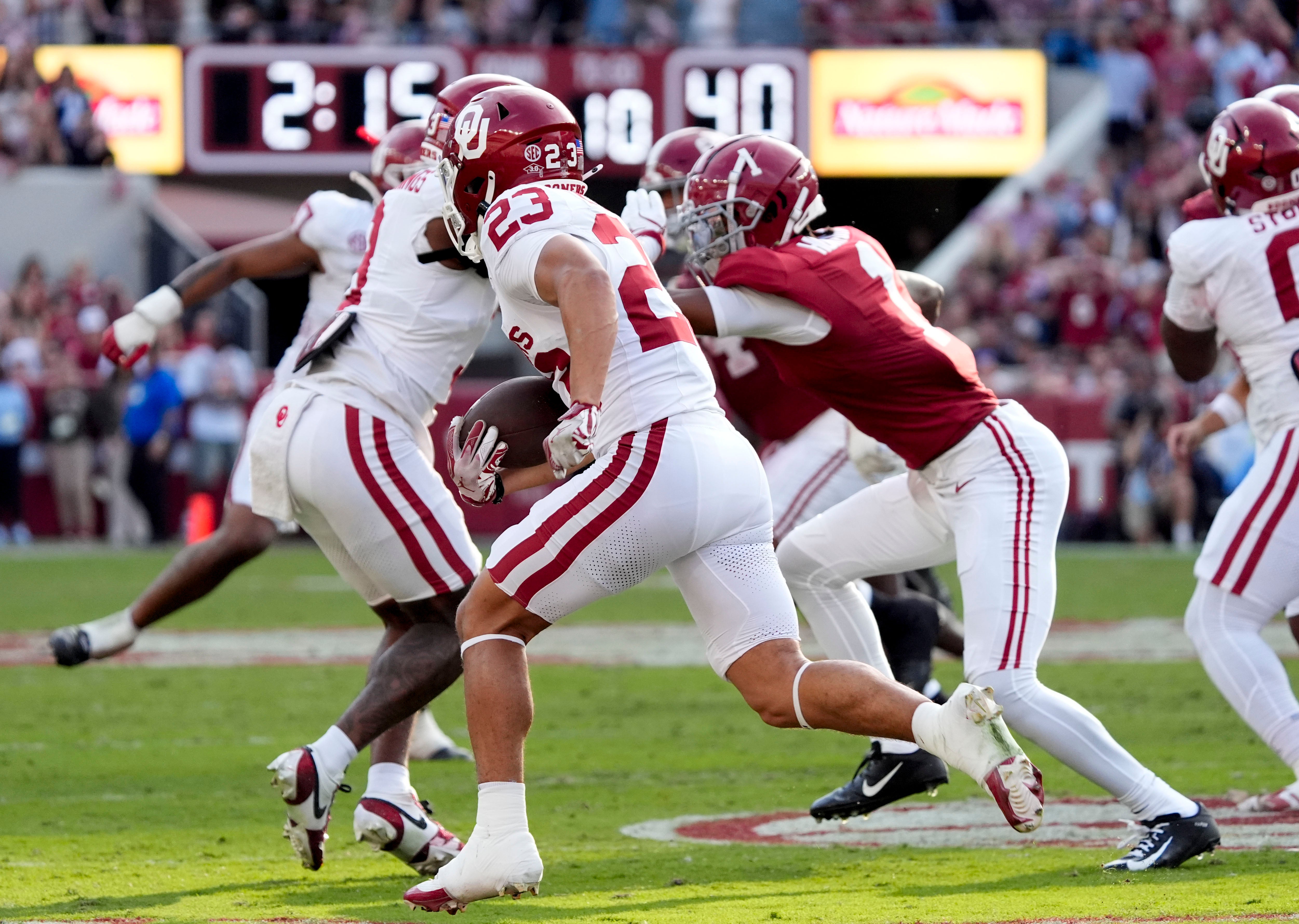 Nov 15, 2025; Tuscaloosa, Alabama, USA; Oklahoma Sooners defensive back Eli Bowen (23) runs a interception back for a touchdown during the first half against the Alabama Crimson Tide at Saban Field at Bryant-Denny Stadium.