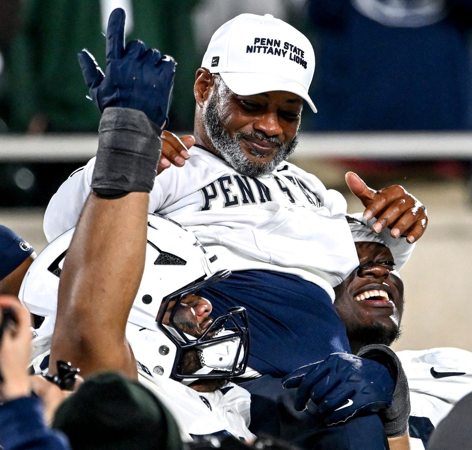 Penn State's interim head coach Terry M. Smith is carried by players after the game against Michigan State on Saturday, Nov. 15, 2025, at Spartan Stadium in East Lansing.