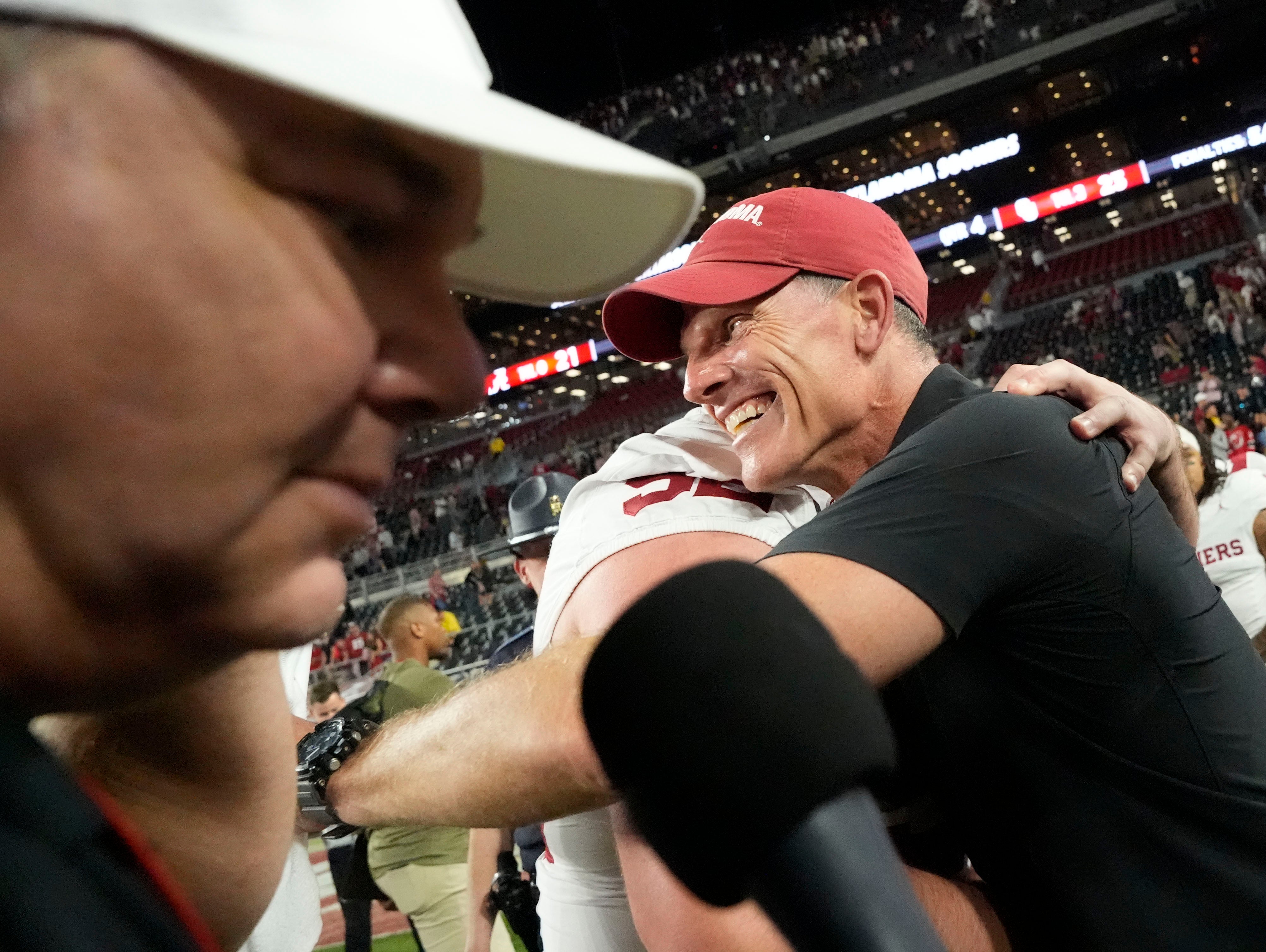 Nov 15, 2025; Tuscaloosa, Alabama, USA; Oklahoma Sooners head coach Brent Venables hugs offensive lineman Troy Everett (52) after Oklahoma defeated the Alabama Crimson Tide 23-21 at Saban Field at Bryant-Denny Stadium.