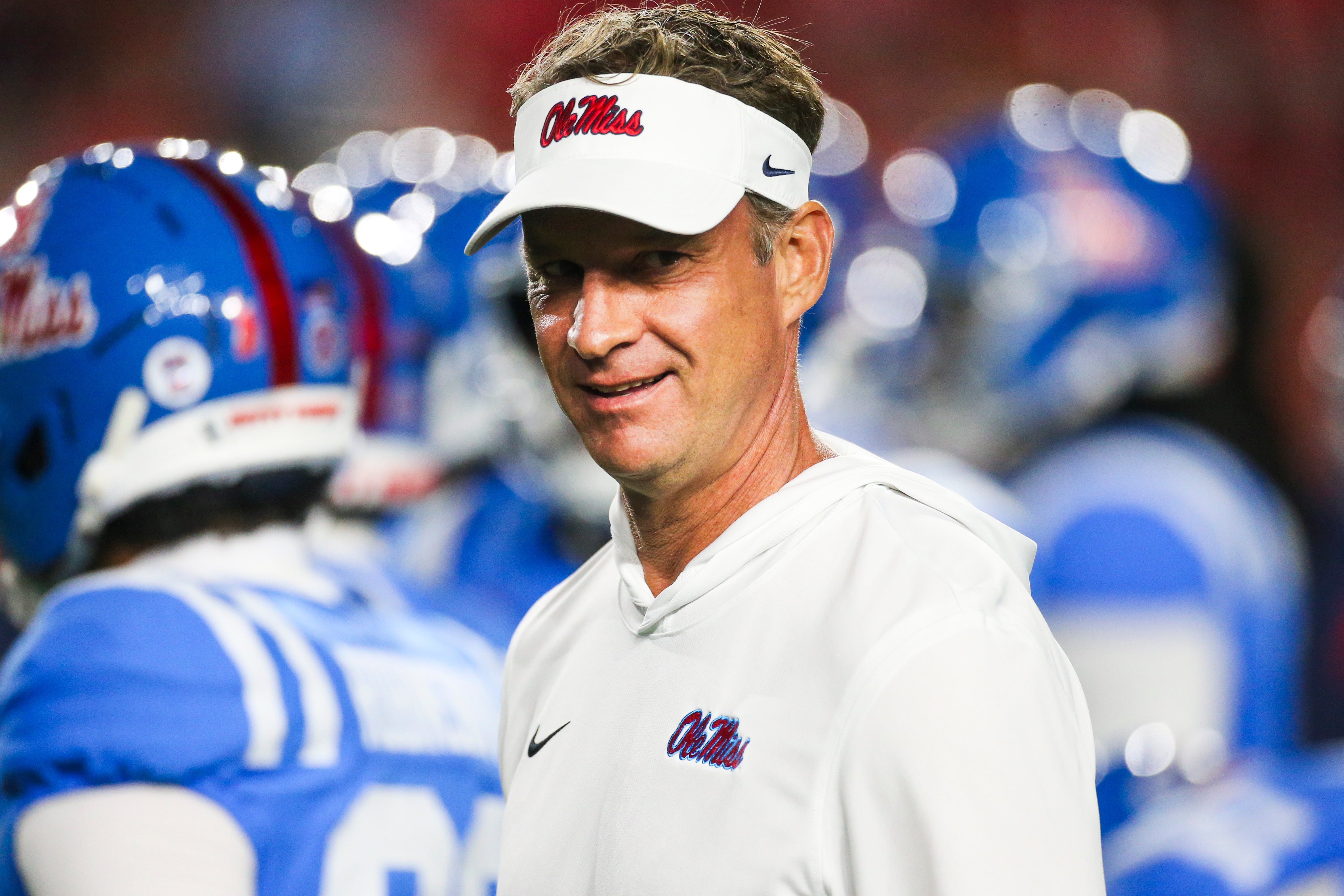 Nov 15, 2025; Oxford, Mississippi, USA; Mississippi Rebels head coach Lane Kiffin watches pregame warmups against the Florida Gators at Vaught-Hemingway Stadium.