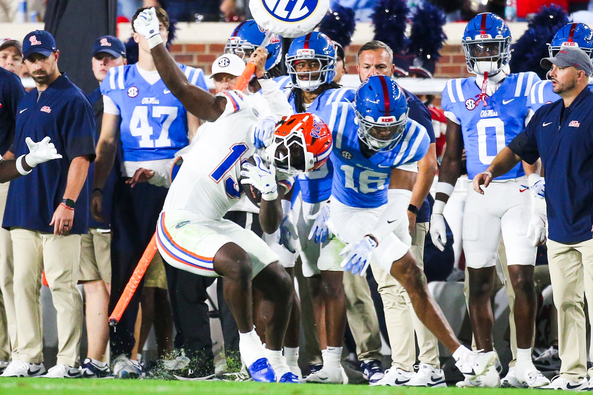 Nov 15, 2025; Oxford, Mississippi, USA; Mississippi Rebels safety Wydett Williams Jr. (16) tackles Florida Gators running back Jadan Baugh (13) during the second quarter at Vaught-Hemingway Stadium.