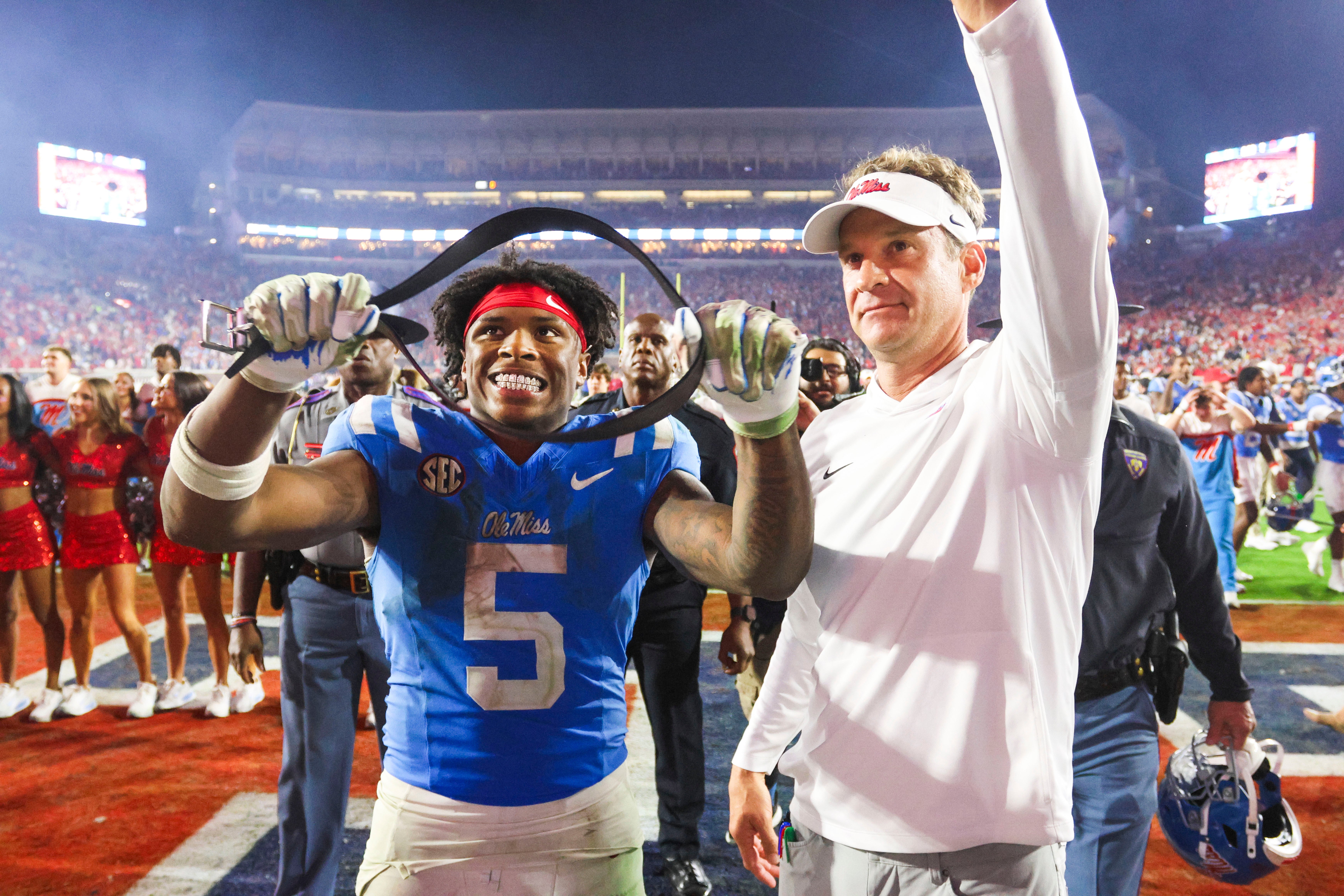 Nov 15, 2025; Oxford, Mississippi, USA; Mississippi Rebels running back Kewan Lacy (5) and head coach Lane Kiffin react after defeating the Florida Gators at Vaught-Hemingway Stadium. Mandatory Credit: Petre Thomas-Imagn Images