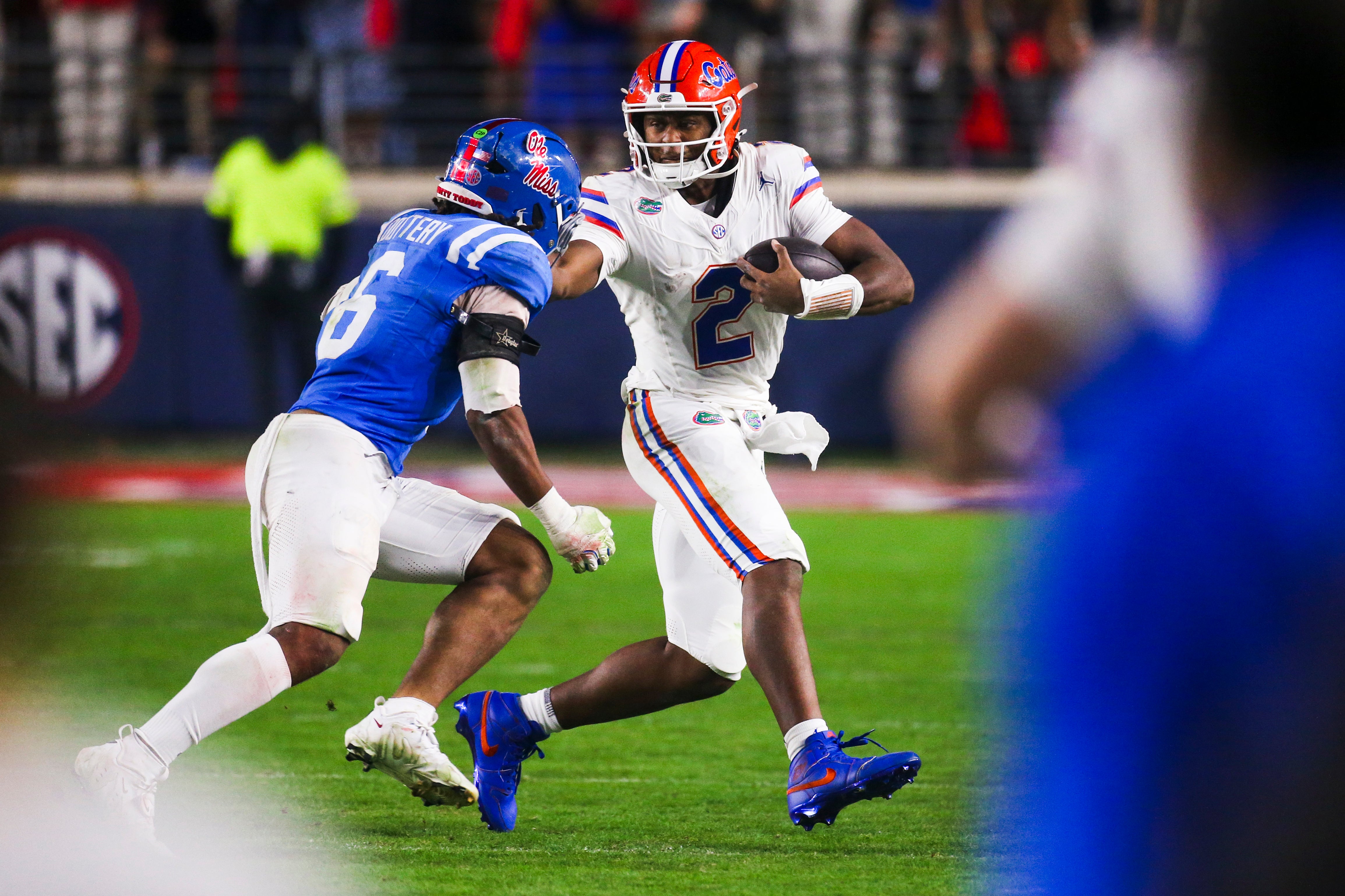 Nov 15, 2025; Oxford, Mississippi, USA; Florida Gators quarterback DJ Lagway (2) scrambles against Mississippi Rebels linebacker TJ Dottery (6) during the second half at Vaught-Hemingway Stadium.