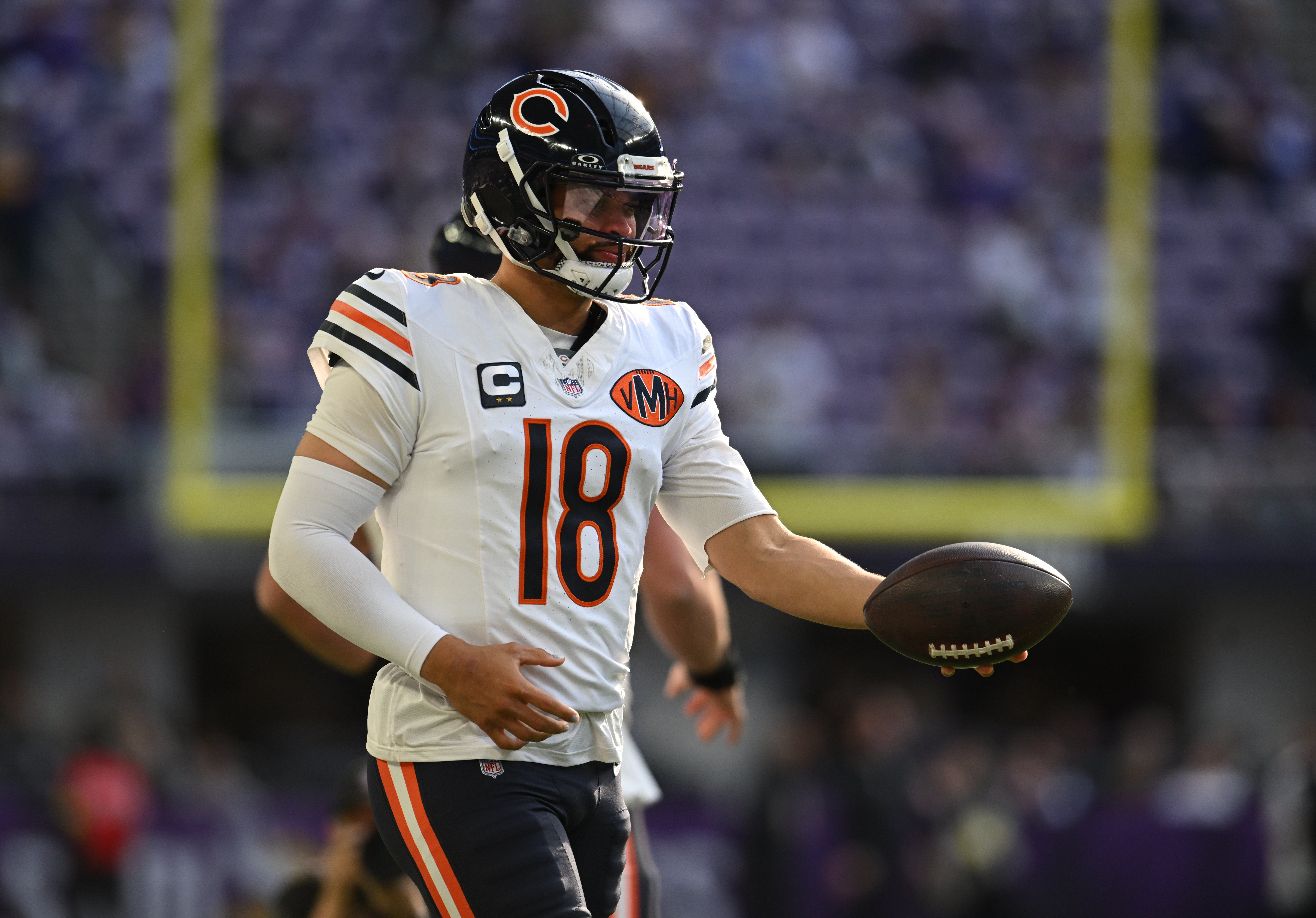 Nov 16, 2025; Minneapolis, Minnesota, USA; Chicago Bears quarterback Caleb Williams (18) warms up before a game against the Minnesota Vikings at U.S. Bank Stadium.