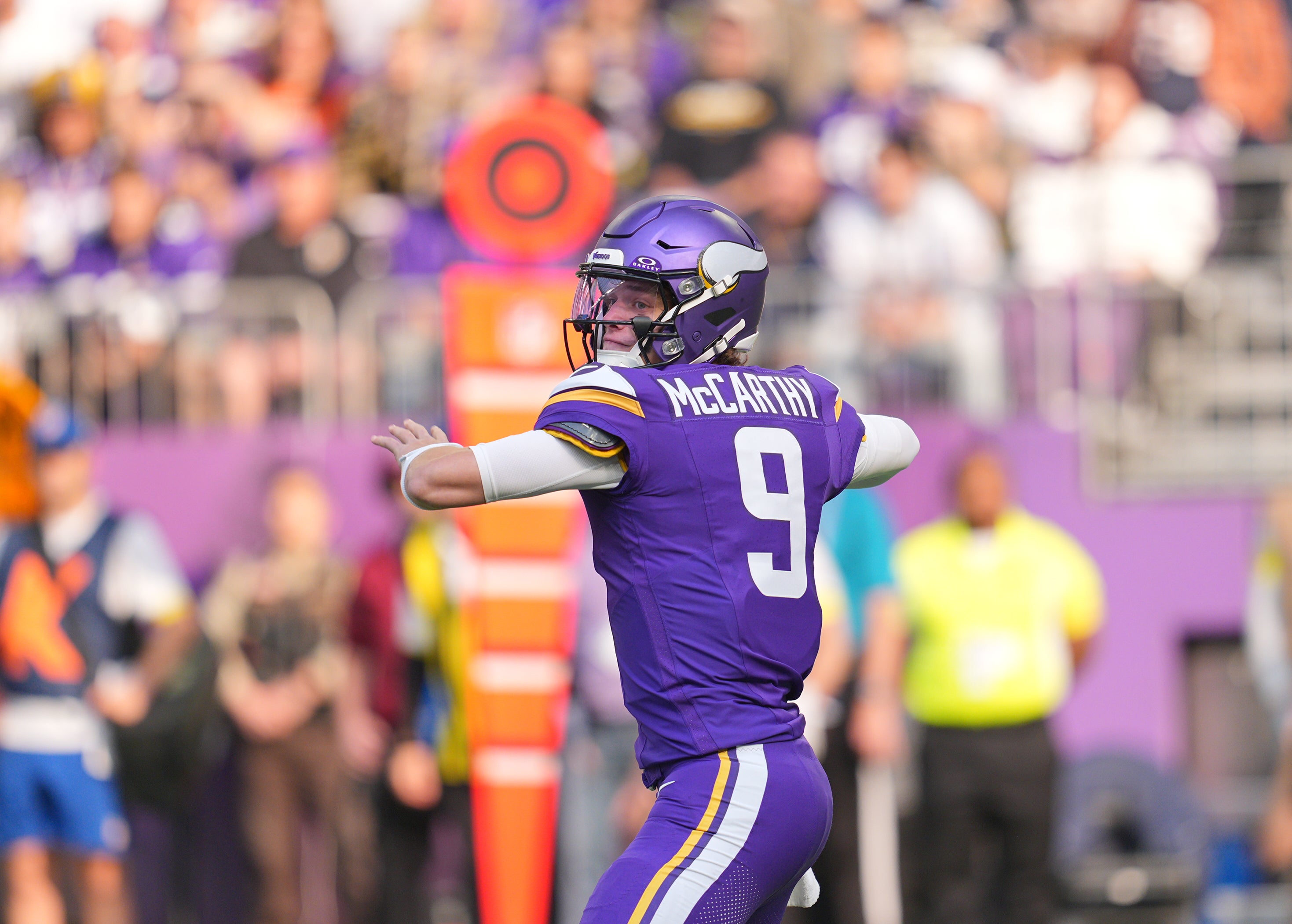 Nov 16, 2025; Minneapolis, Minnesota, USA; Minnesota Vikings quarterback J.J. McCarthy (9) throws downfield during the first quarter against the Chicago Bears at U.S. Bank Stadium.