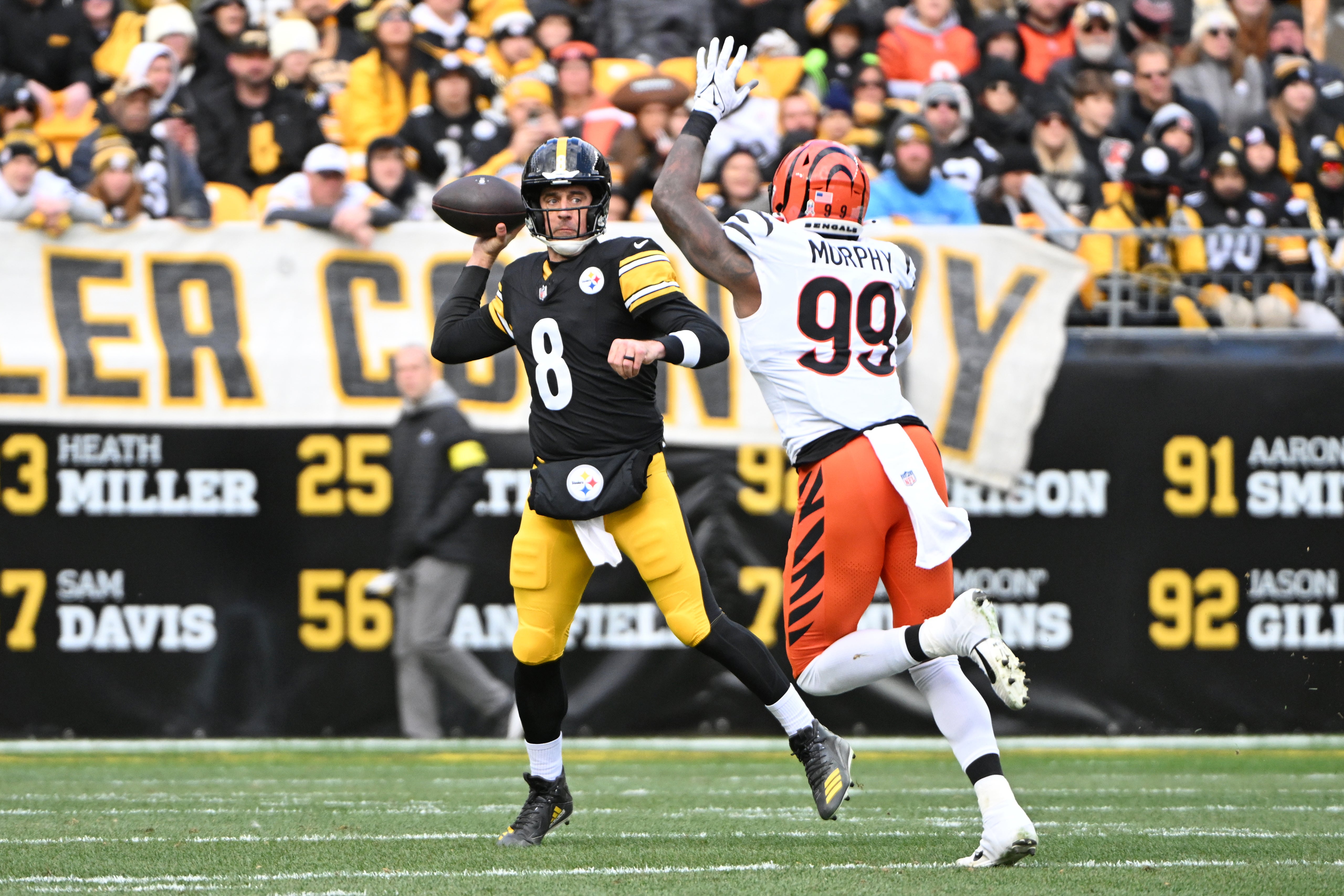 Nov 16, 2025; Pittsburgh, Pennsylvania, USA; Pittsburgh Steelers quarterback Aaron Rodgers (8) passes the ball against Cincinnati Bengals defensive end Myles Murphy (99) during the first half at Acrisure Stadium.