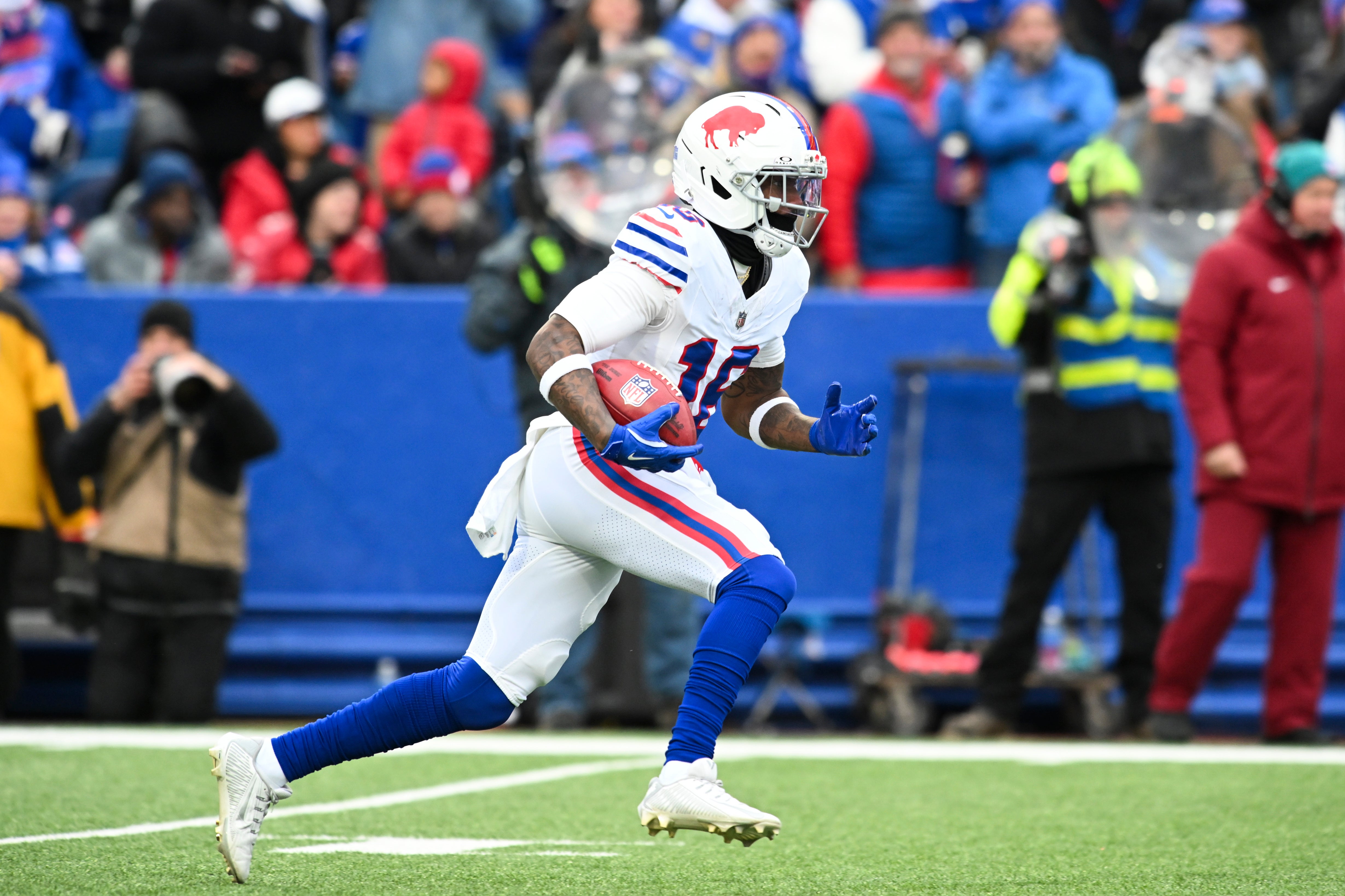 Nov 16, 2025; Orchard Park, New York, USA; Buffalo Bills wide receiver Mecole Hardman (16) returns a kickoff against the Tampa Bay Buccaneers during the first quarter of the game at Highmark Stadium.