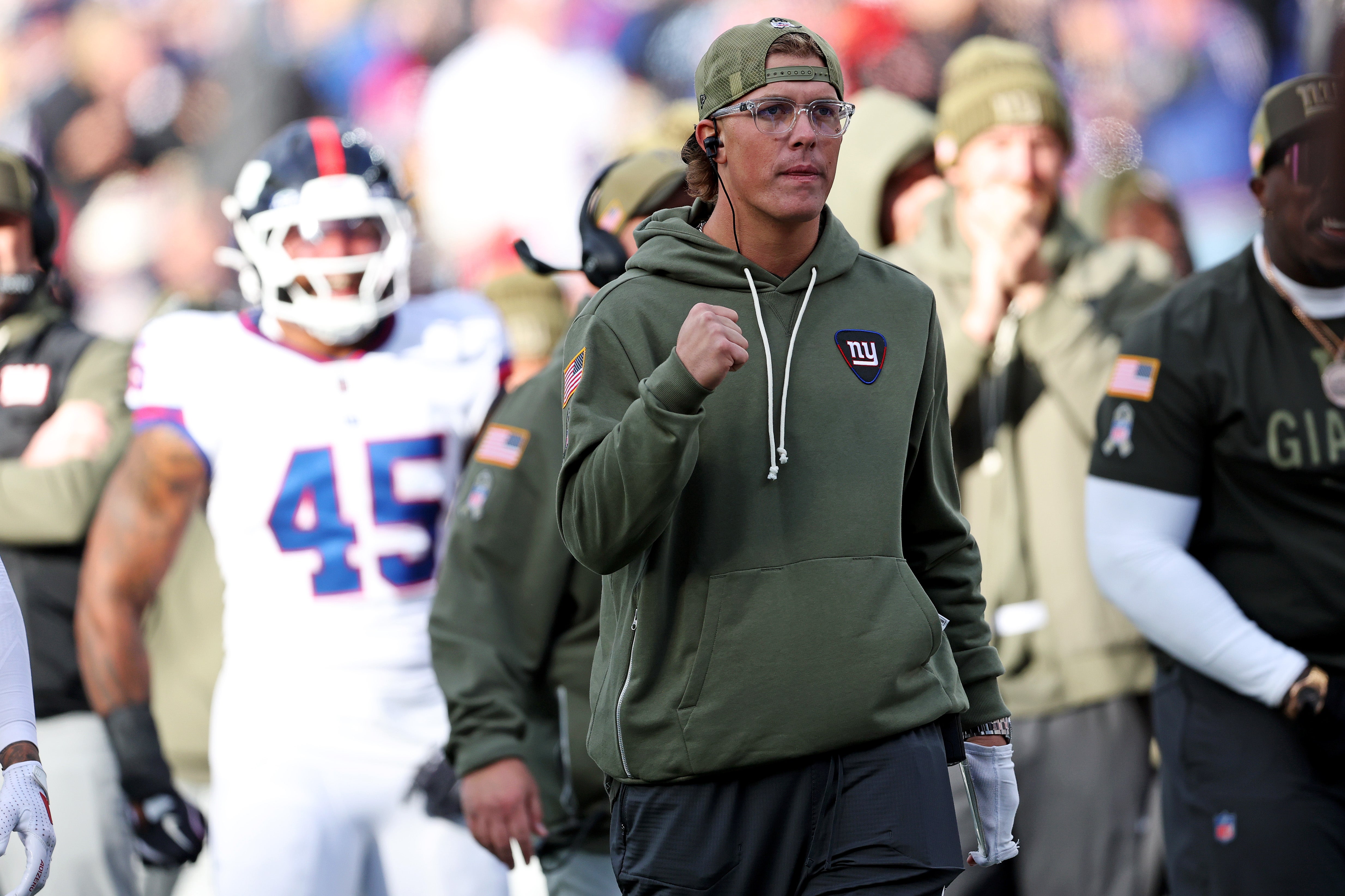 Nov 16, 2025; East Rutherford, New Jersey, USA; New York Giants injured quarterback Jaxson Dart (6) cheers on the sidelines during the second quarter of the game against the Green Bay Packers at MetLife Stadium.