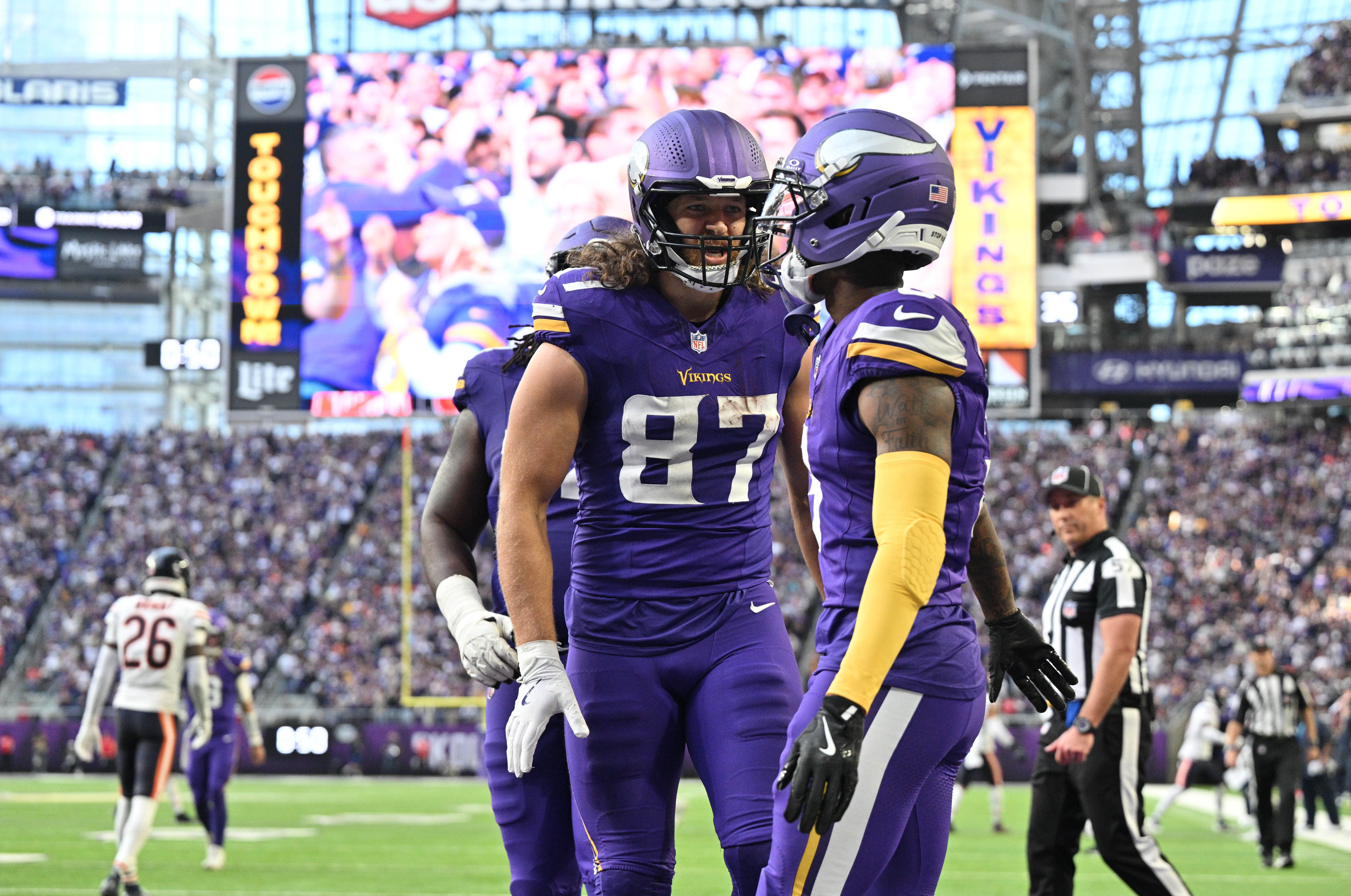 Nov 16, 2025; Minneapolis, Minnesota, USA; Minnesota Vikings wide receiver Jordan Addison (3) and tight end T.J. Hockenson (87) celebrate a touchdown during the fourth quarter against the Chicago Bears at U.S. Bank Stadium.