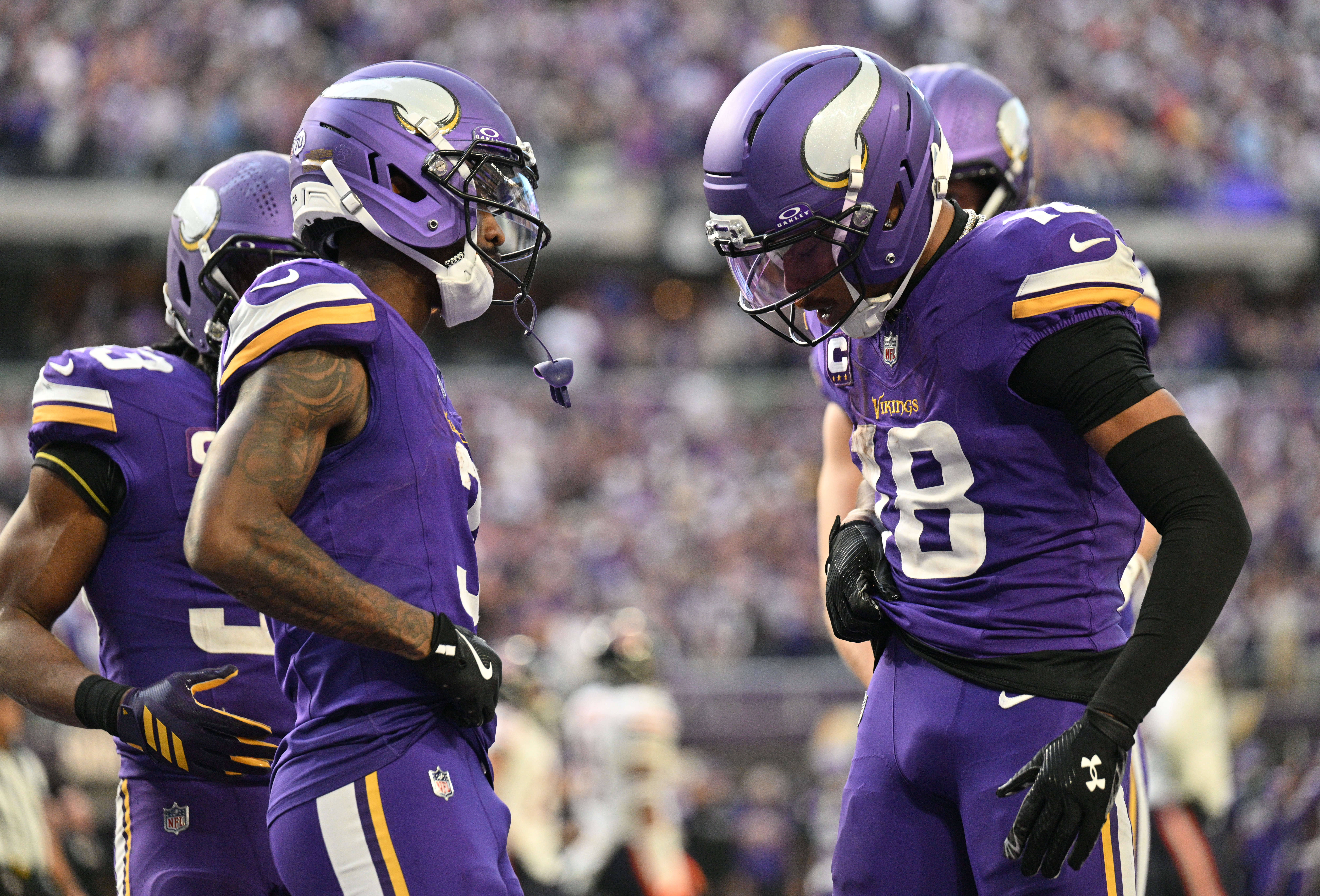 Nov 16, 2025; Minneapolis, Minnesota, USA; Minnesota Vikings wide receiver Jordan Addison (3) and wide receiver Justin Jefferson (18) celebrate a touchdown during the fourth quarter against the Chicago Bears at U.S. Bank Stadium.