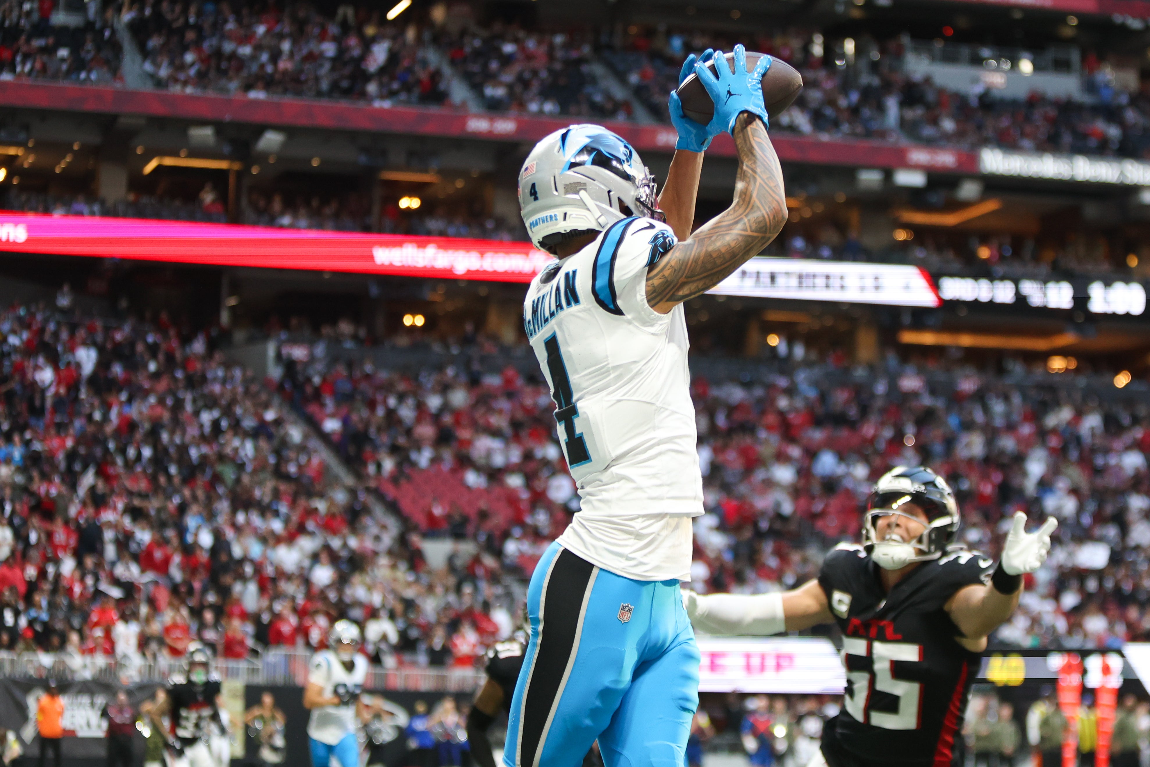 Nov 16, 2025; Atlanta, Georgia, USA; Carolina Panthers wide receiver Tetairoa McMillan (4) catches the ball for a touchdown in the fourth quarter against the Atlanta Falcons at Mercedes-Benz Stadium.