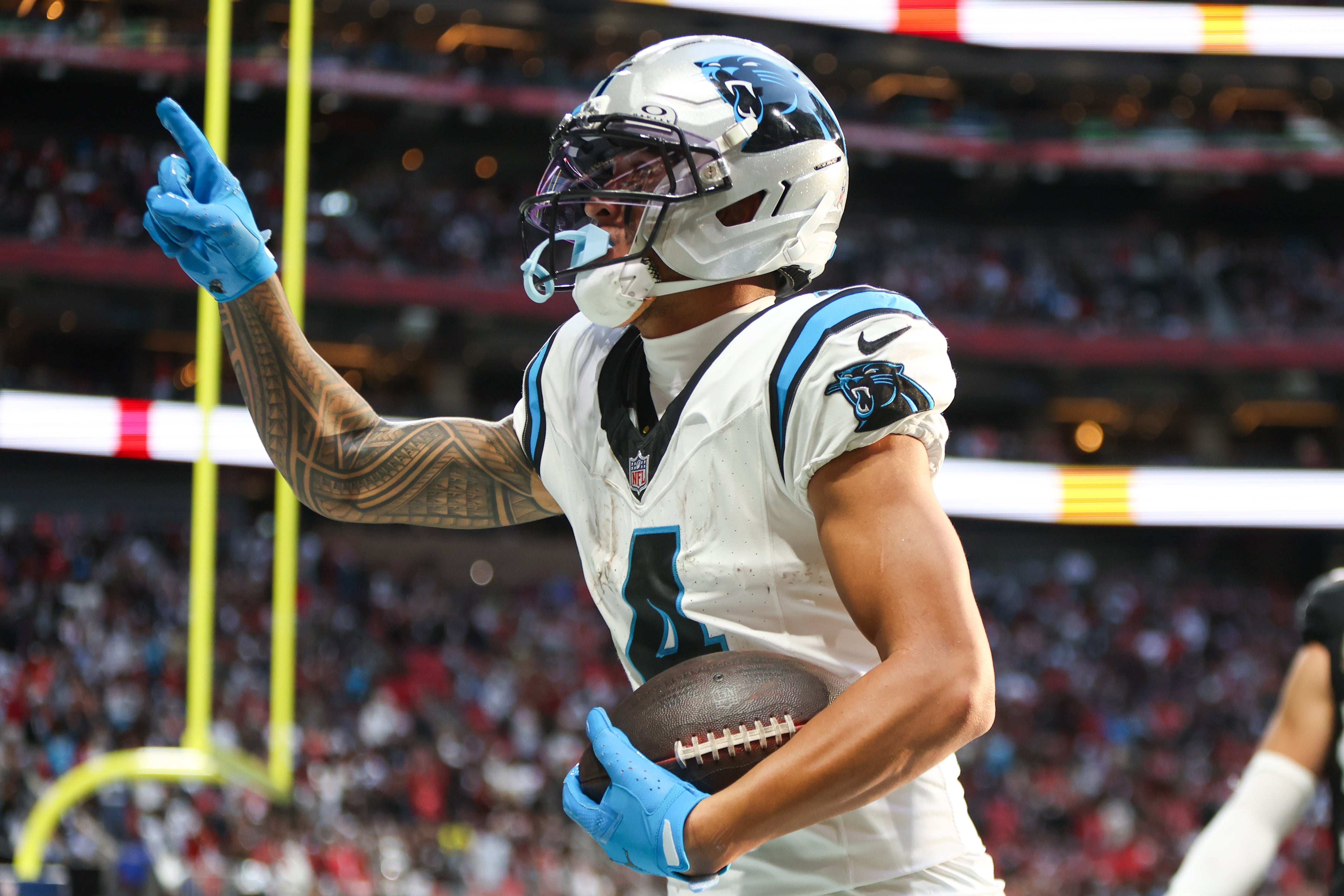 Nov 16, 2025; Atlanta, Georgia, USA; Carolina Panthers wide receiver Tetairoa McMillan (4) celebrates a touchdown in the fourth quarter against the Atlanta Falcons at Mercedes-Benz Stadium.