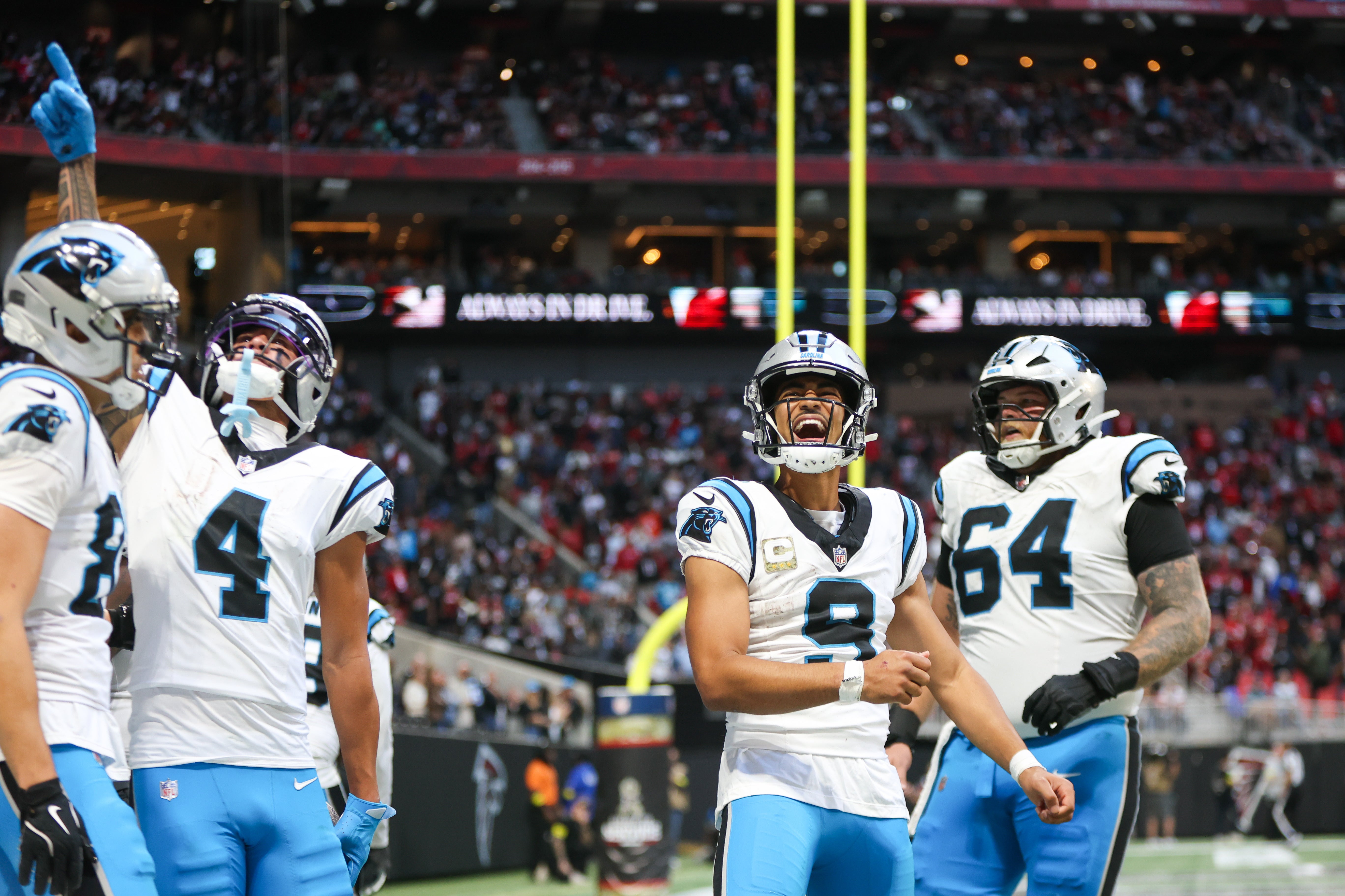 Nov 16, 2025; Atlanta, Georgia, USA; Carolina Panthers quarterback Bryce Young (9) reacts to a touchdown in the fourth quarter against the Atlanta Falcons at Mercedes-Benz Stadium.