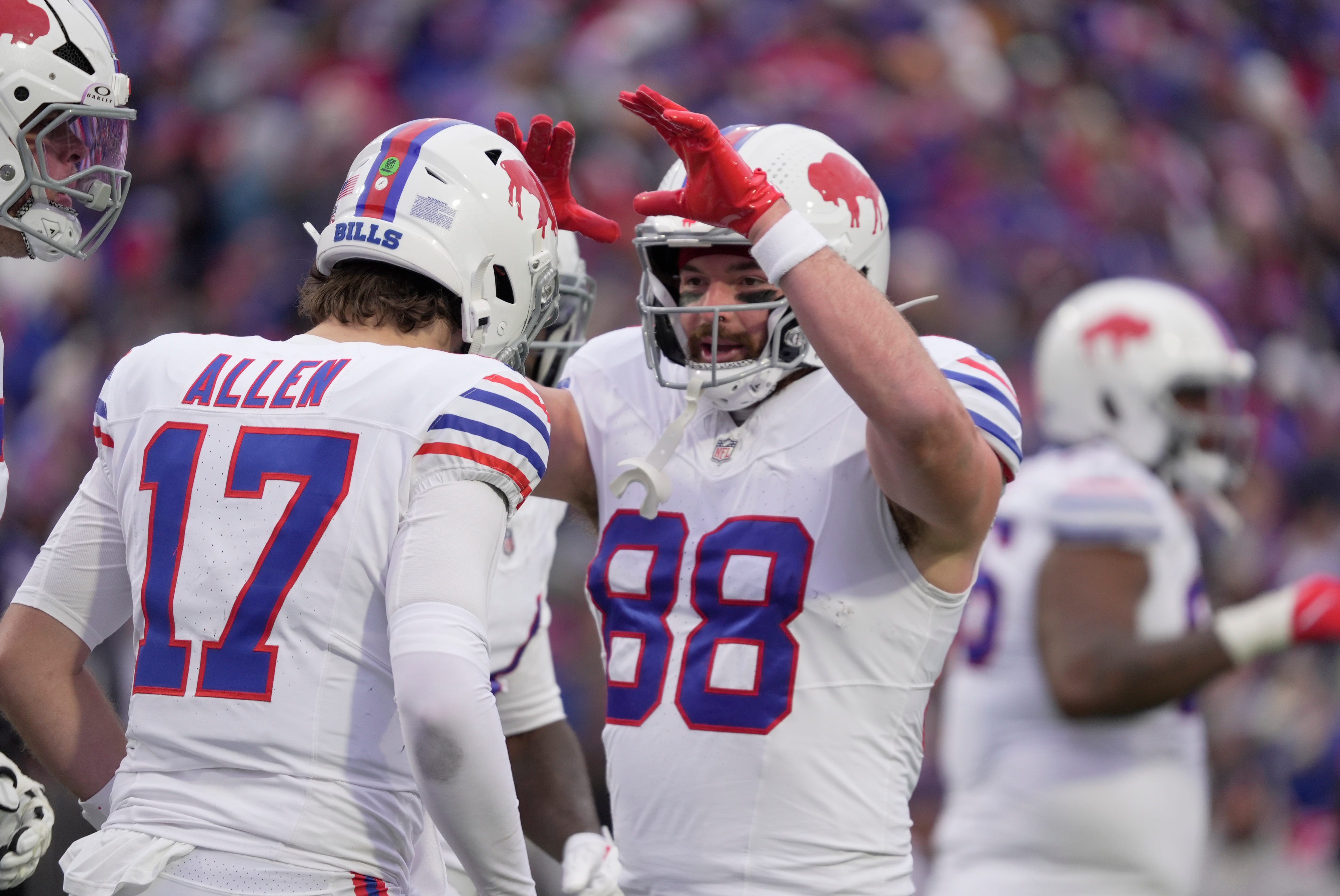 Buffalo Bills tight end Dawson Knox high fives Buffalo Bills quarterback Josh Allen who just scored on a two-yard touchdown run during first half action against the Tampa Bay Buccaneers on Nov 16, 2025 at Highmark Stadium in Orchard Park.